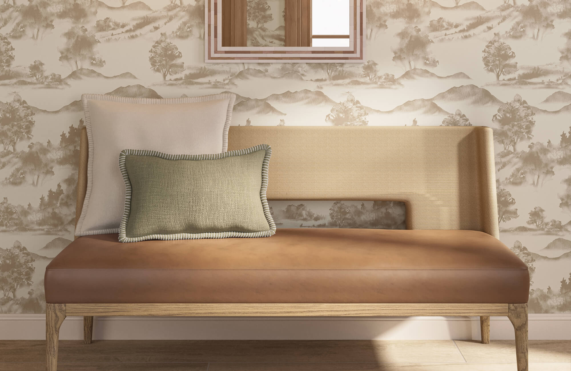 Layered square and lumbar pillows on a tan bench with landscape wallpaper and a framed wall mirror.