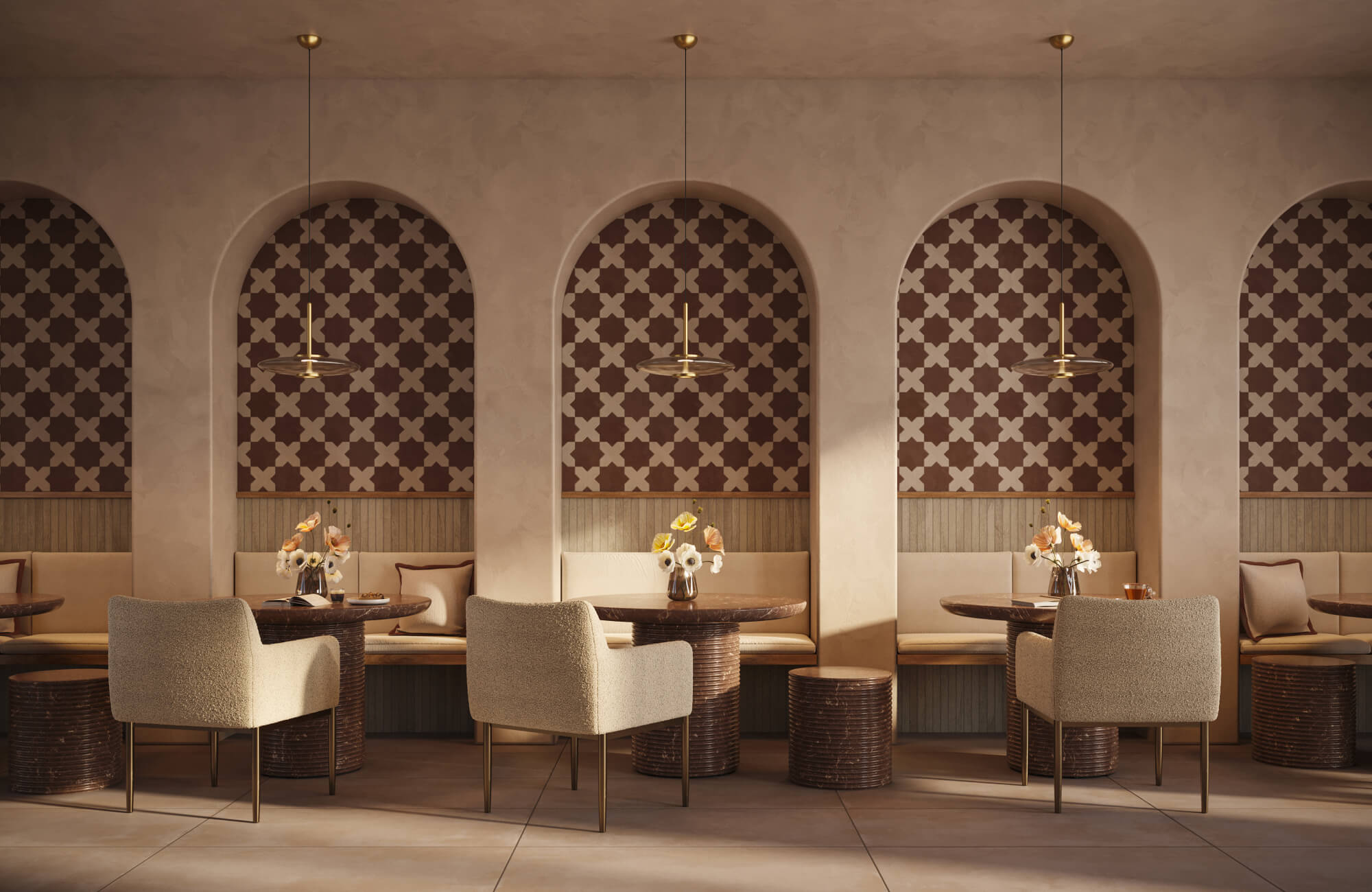 Neutral dining lounge with upholstered chairs, arched alcove banquettes, patterned tile walls, and small accent pillows.