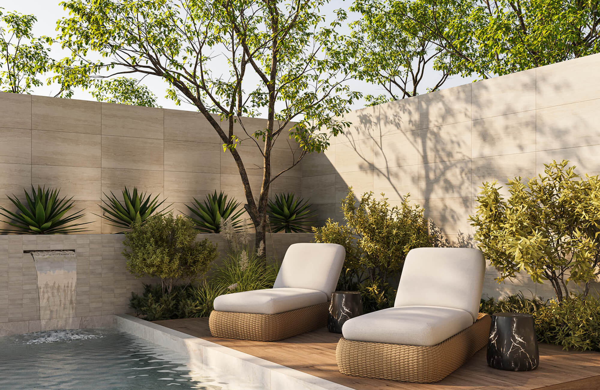 null Minimalist poolside retreat with cushioned woven loungers on a wood-look deck beside a modern water feature and landscaped privacy wall.
