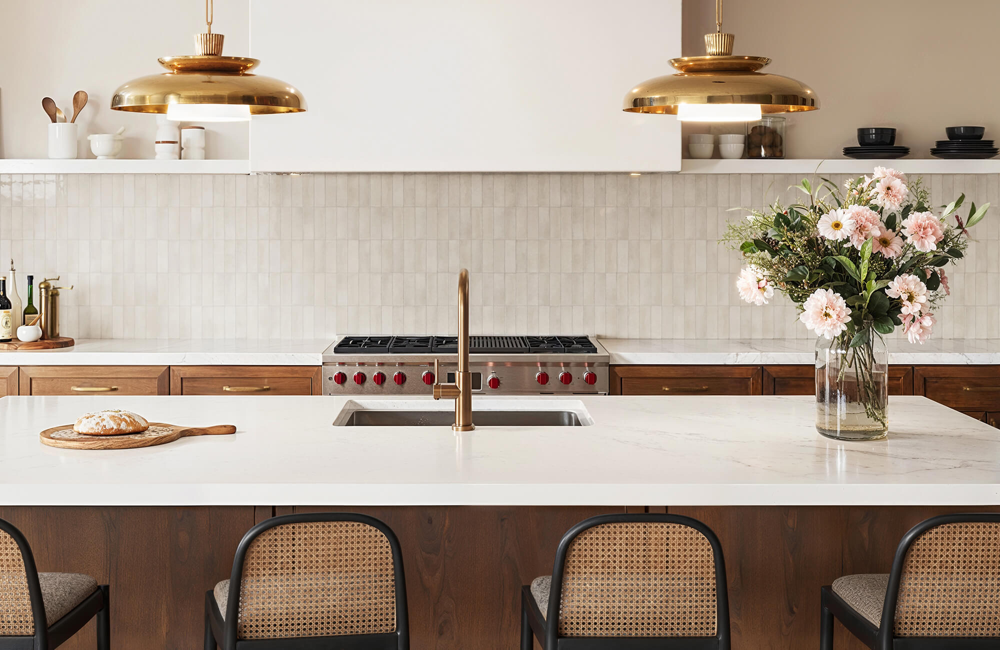 null Bright contemporary kitchen with a glossy neutral Zellige tile backsplash, warm wood cabinetry, marble countertops, and brass accents creating a harmonious balance of texture and elegance.