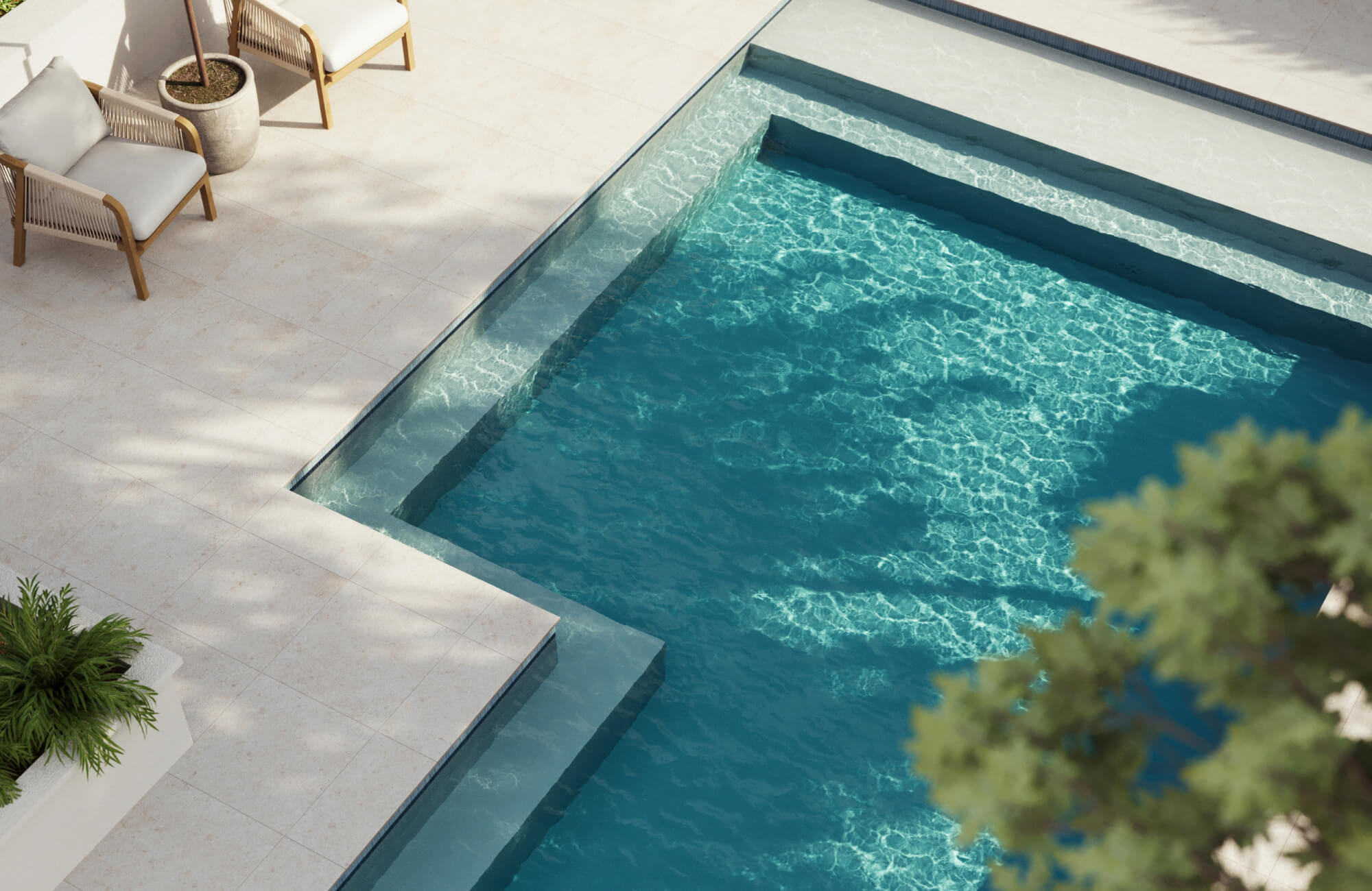 Sunlit poolside with creamy textured tiles and shimmering aqua water, creating a serene, resort-style ambiance.