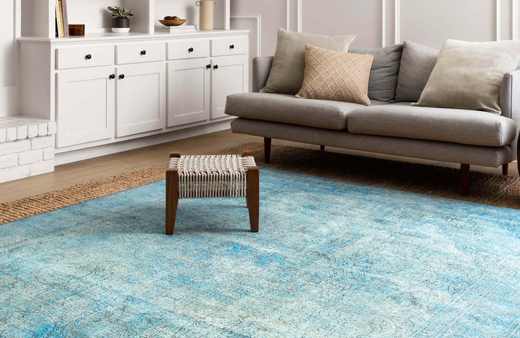 null Bright boho rug in soft blue tones, adding a cool, airy pop of color in a light and modern living space.