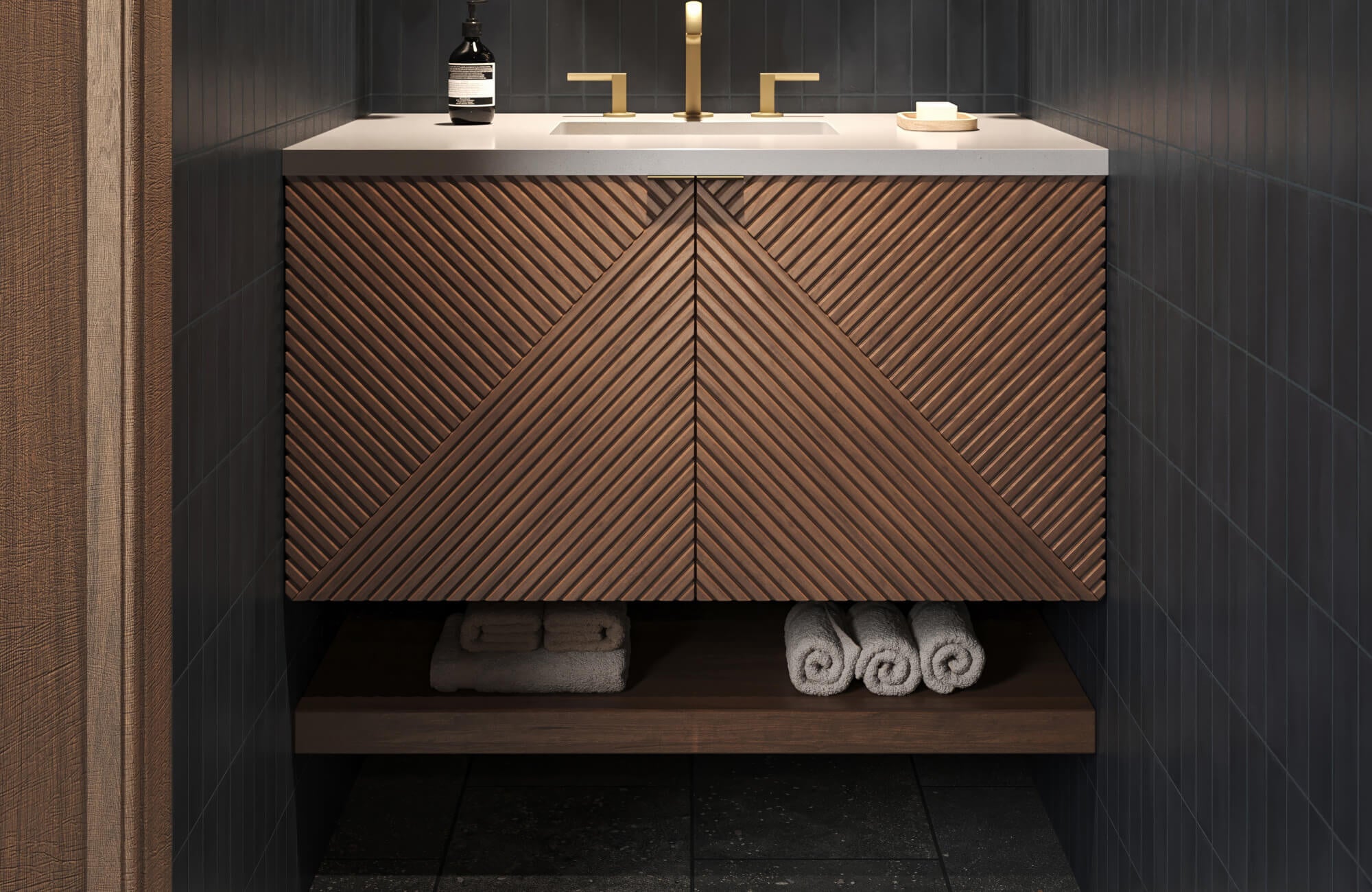 null Modern vanity with bold geometric wood paneling, brass fixtures, and deep-toned vertical tile walls.