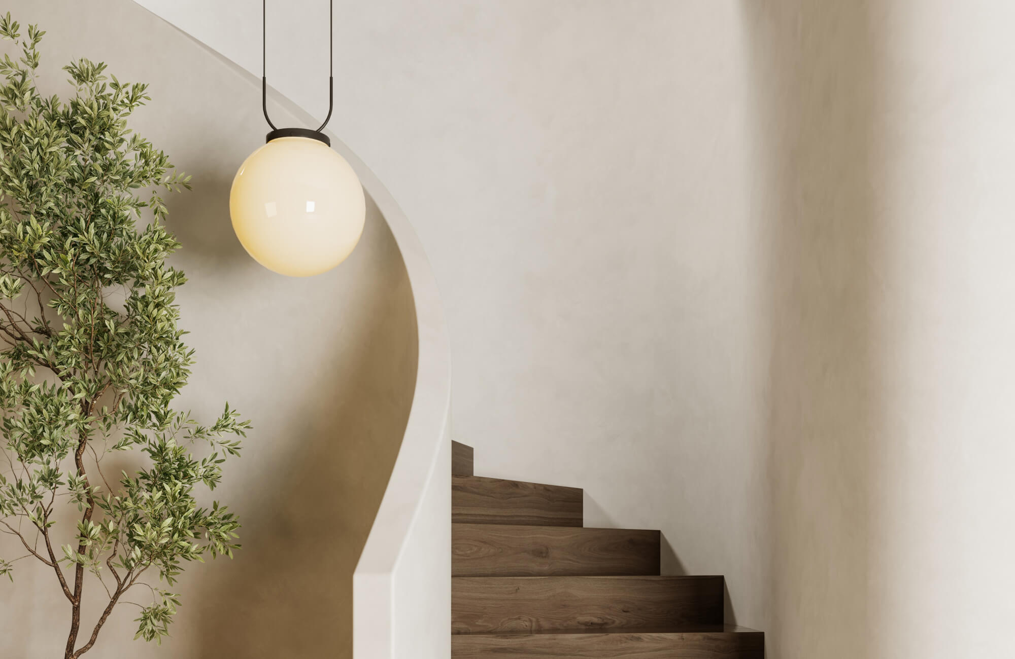 Modern globe pendant light illuminates a curved staircase with warm wood steps and smooth plaster walls for a serene look.