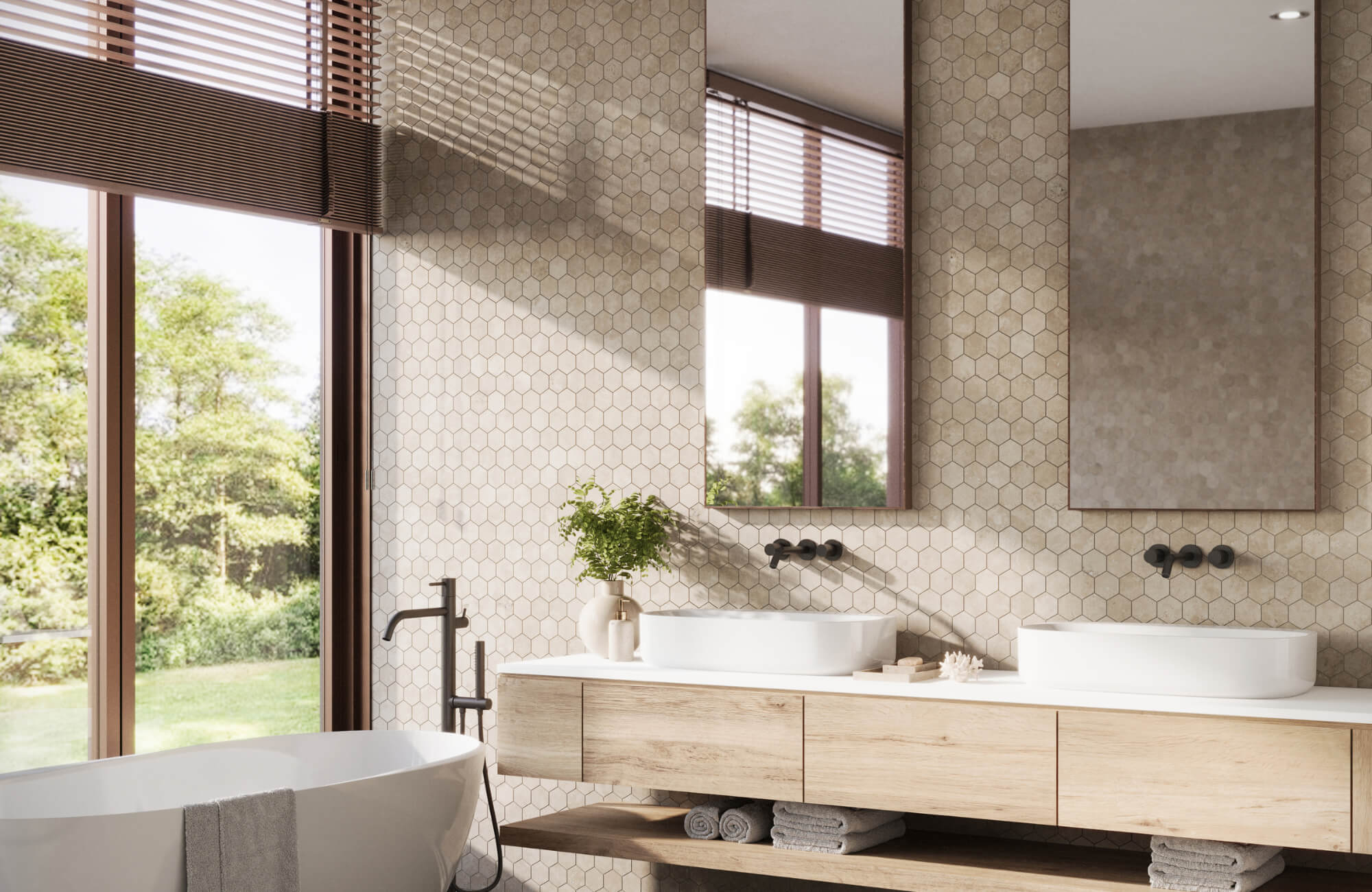 Bright bathroom with light beige hex tiles, wood vanity, freestanding tub, and large windows bringing in natural light.