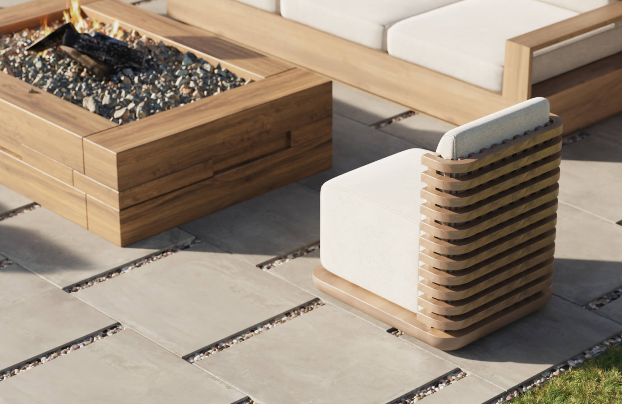 null Stylish patio scene featuring smooth gray paver tiles spaced with pebble joints, paired with modern wooden furniture and a fire pit that together create a warm, sophisticated outdoor ambiance.