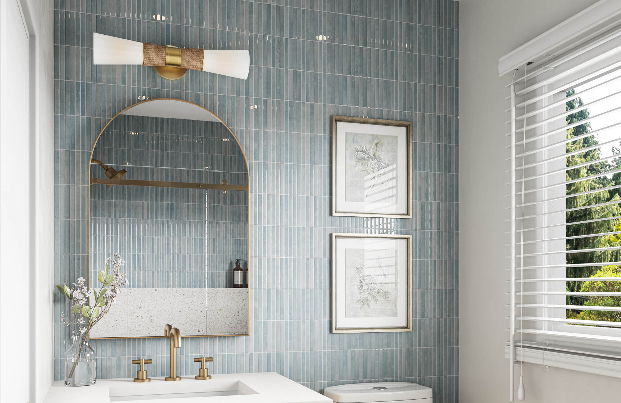 null Bright bathroom with woven accent wall sconce, brass arched mirror, vertical blue tile backsplash, and white vanity for stylish task lighting