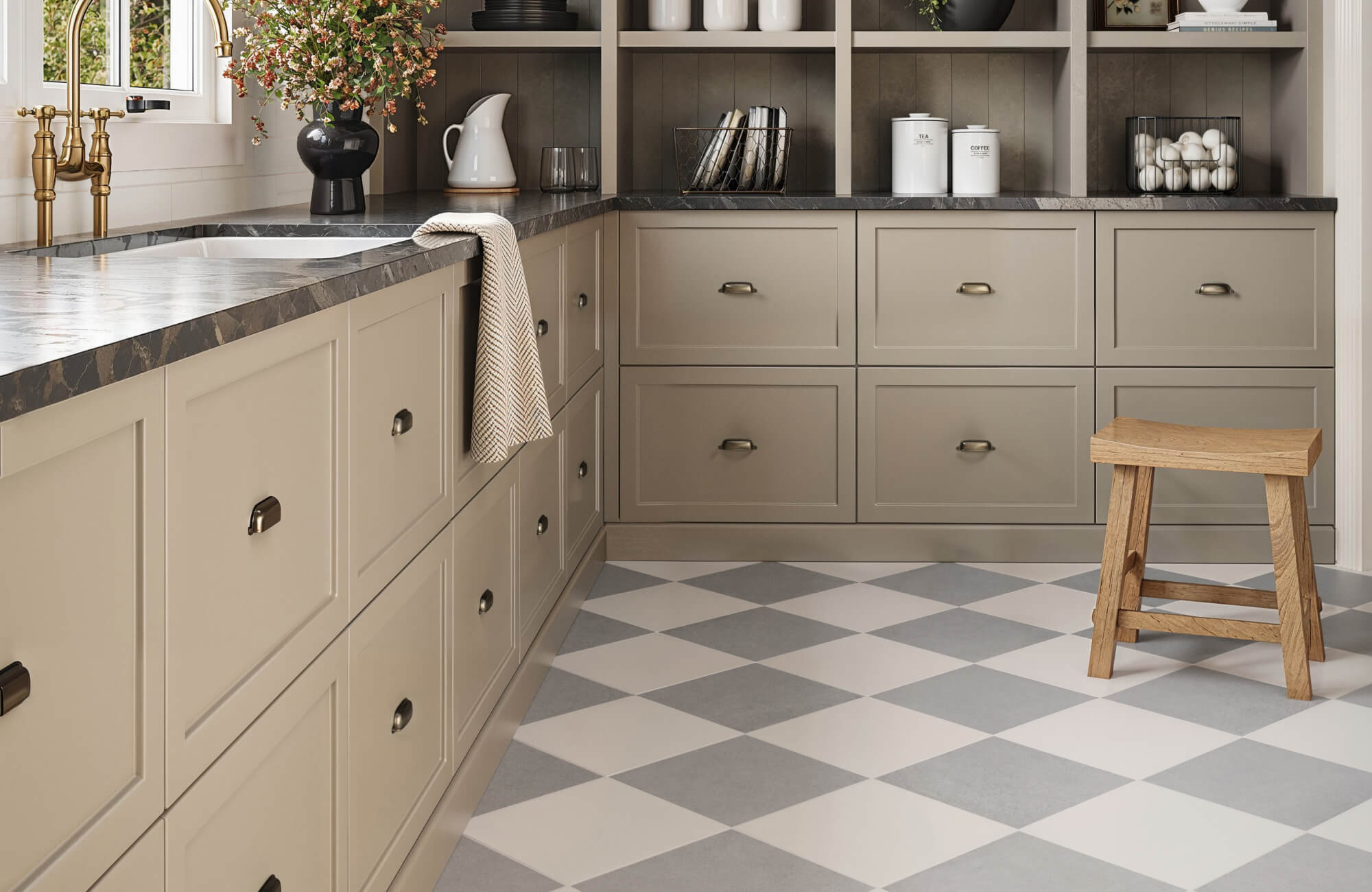 null Charming kitchen with beige cabinetry, black marble countertops, and light gray and white checkered floor tiles, creating a warm and rustic atmosphere.