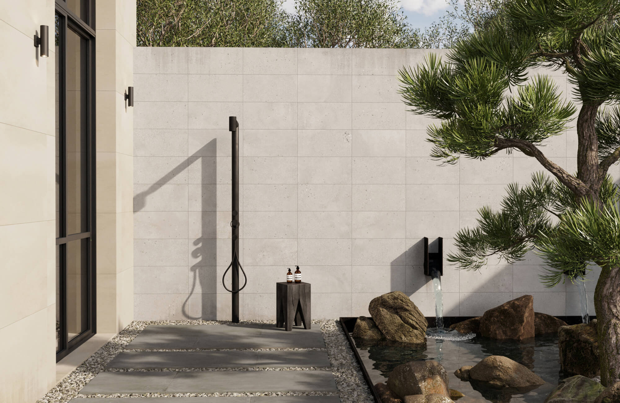 null Minimal outdoor shower beside a reflective water feature with light stone tiles, gravel paths, and sculptural pine trees nearby.