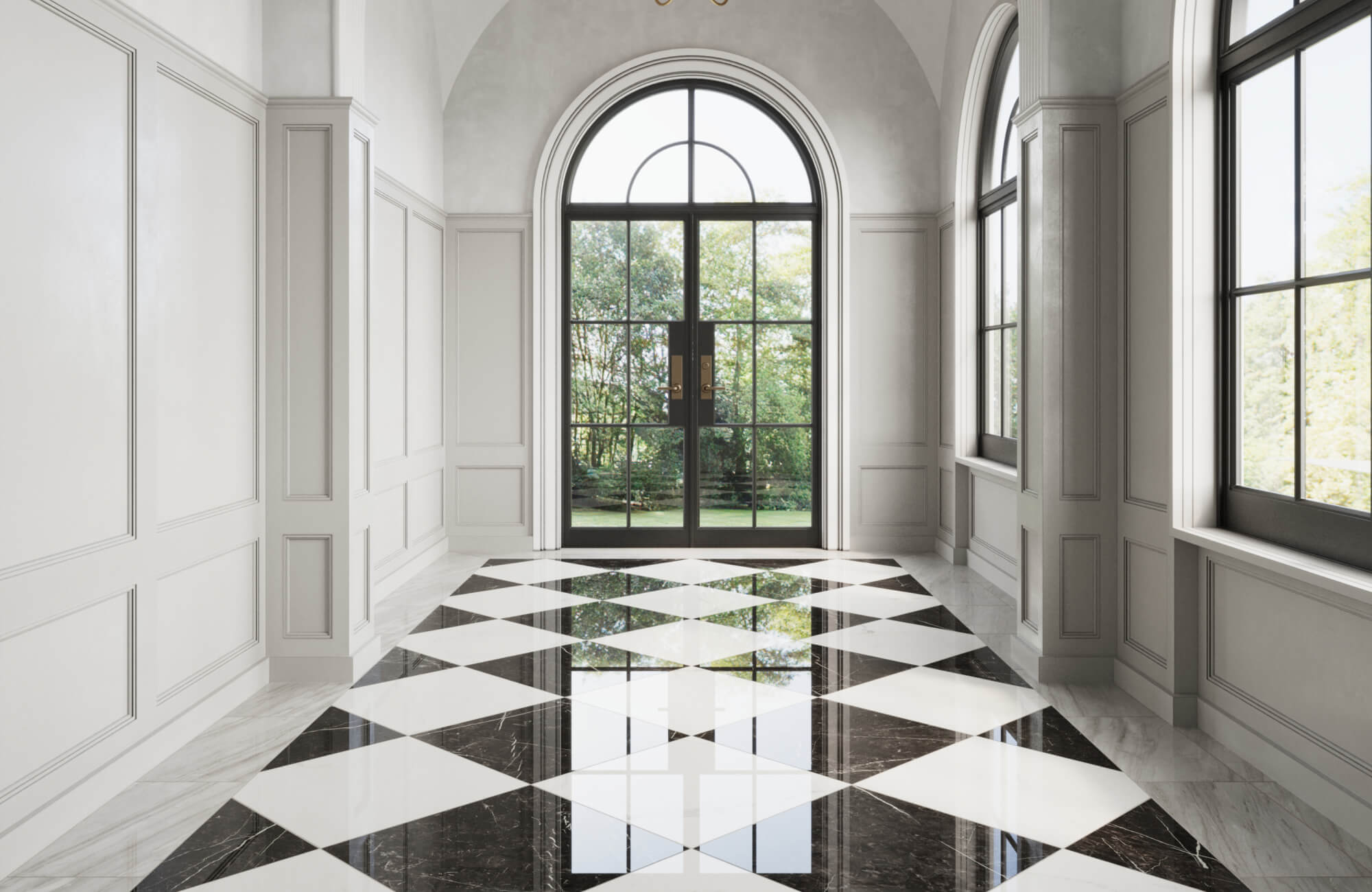 Elegant hallway with black and white checkered tiles and arched glass doors, opening to a lush garden.