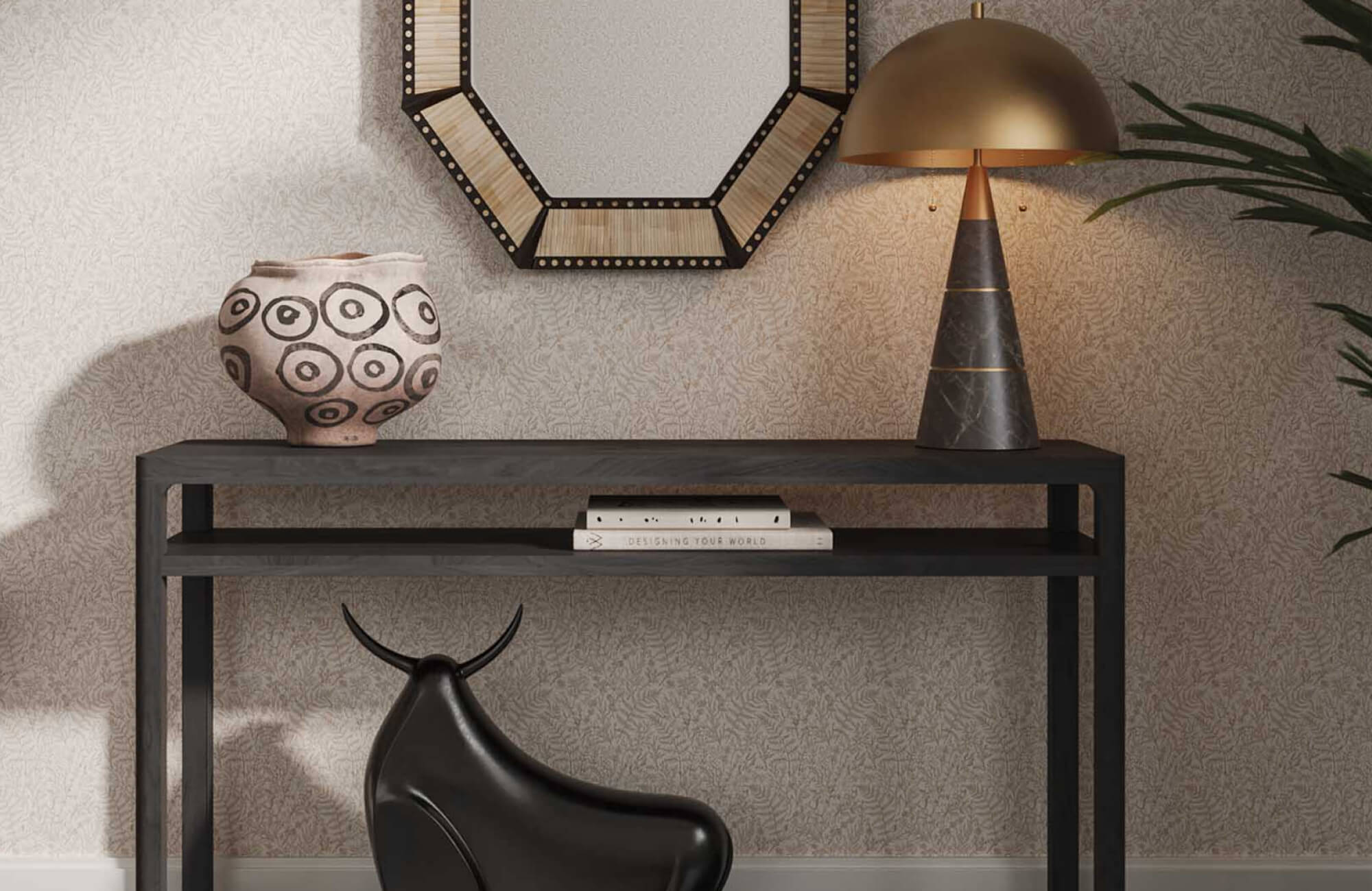 null Patterned round decorative vessel on a black console table beneath a geometric wall mirror, styled with a dome lamp, books, and sculptural decor.