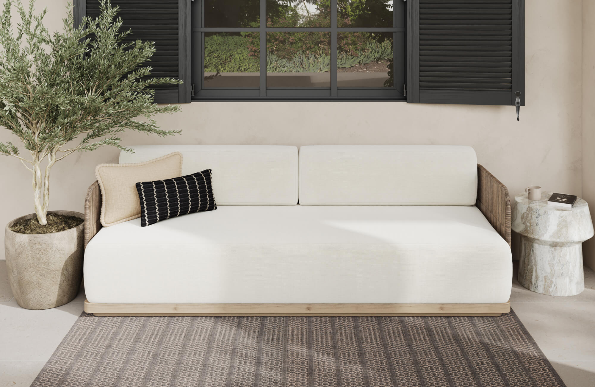 null Minimalist sofa with a mix of lumbar and patterned decorative pillows, showing contrast in shape and design within a clean, modern setting.