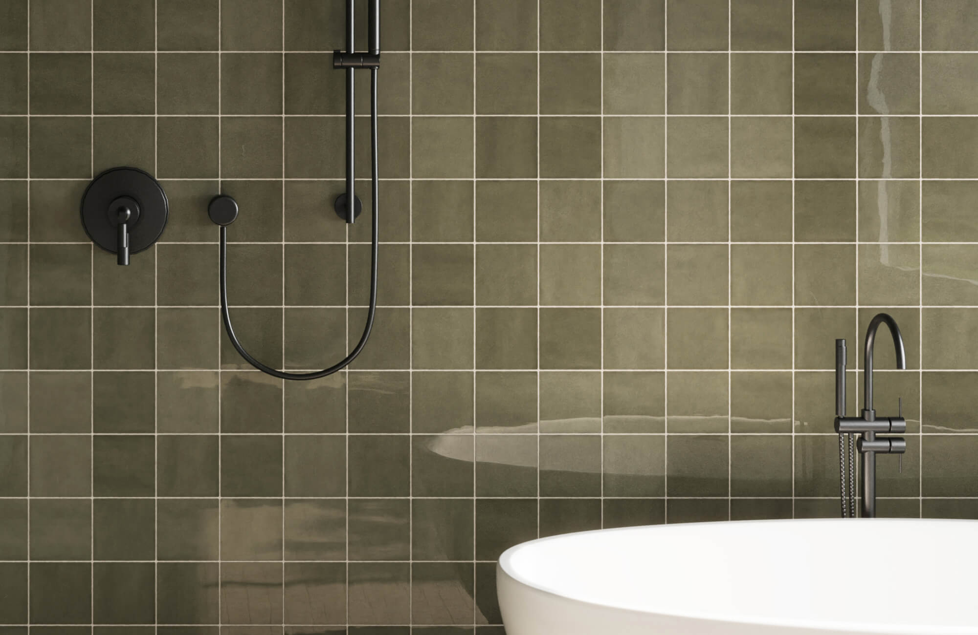 Glossy olive green ceramic tiles add rich depth and contrast to this modern bath with sleek matte black fixtures.