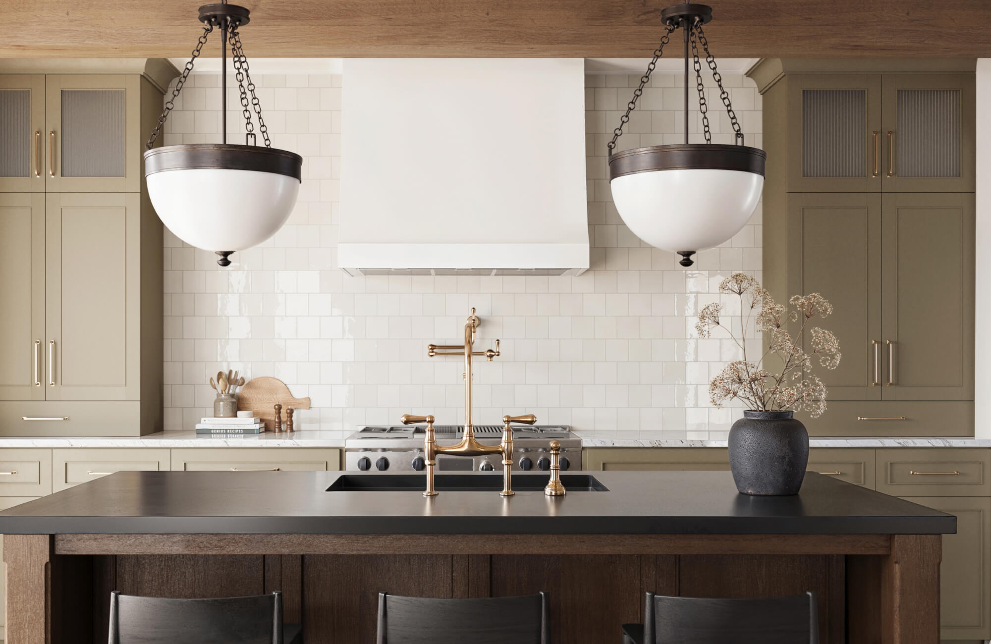 Glossy off-white ceramic tiles create a luminous backsplash, elevating this warm, modern kitchen with timeless elegance.
