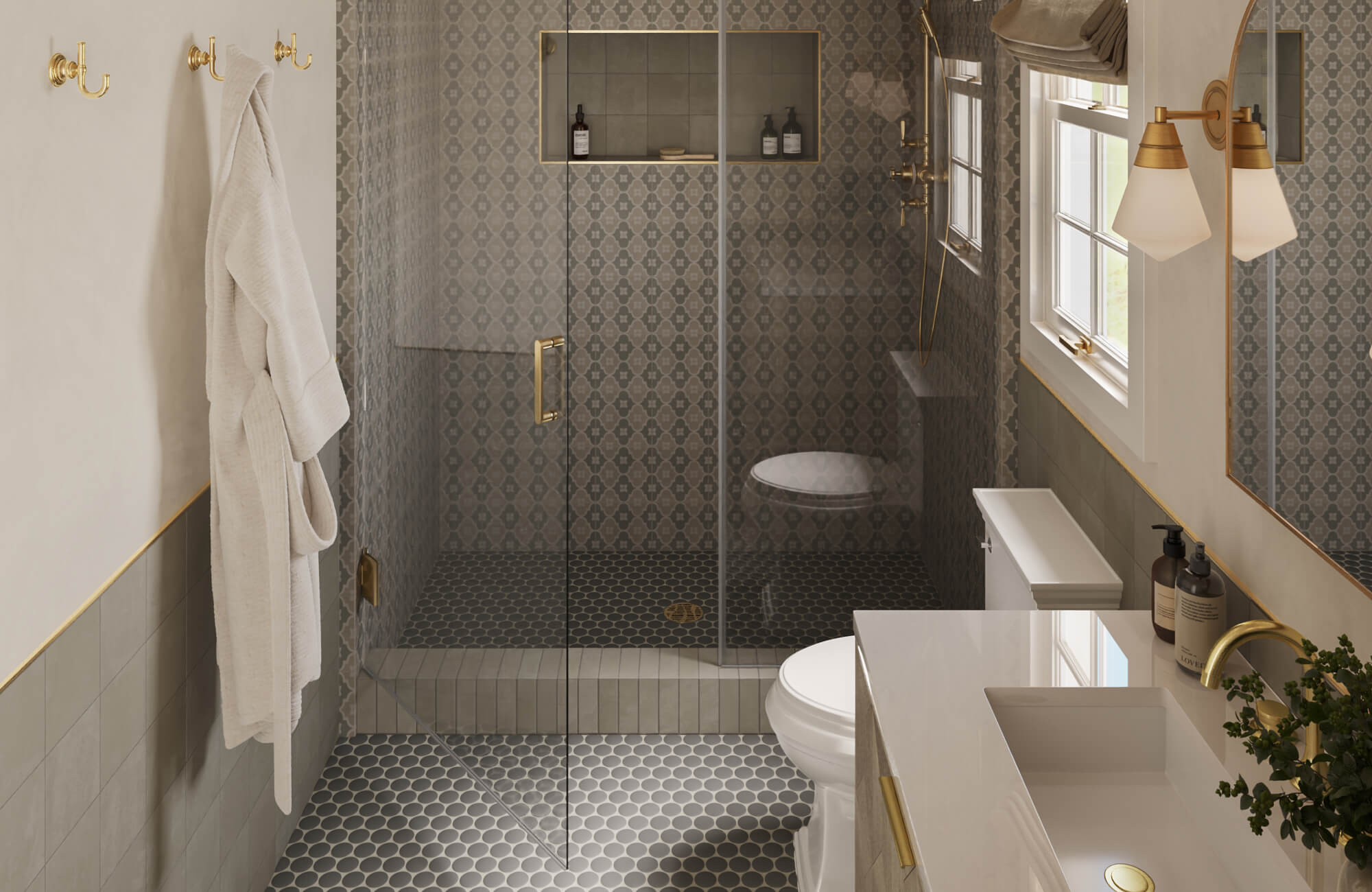Classic, elegant bathroom featuring patterned shower walls, warm brass fixtures, and a soft gray penny round tile floor that adds texture, slip resistance, and timeless charm to the refined space.