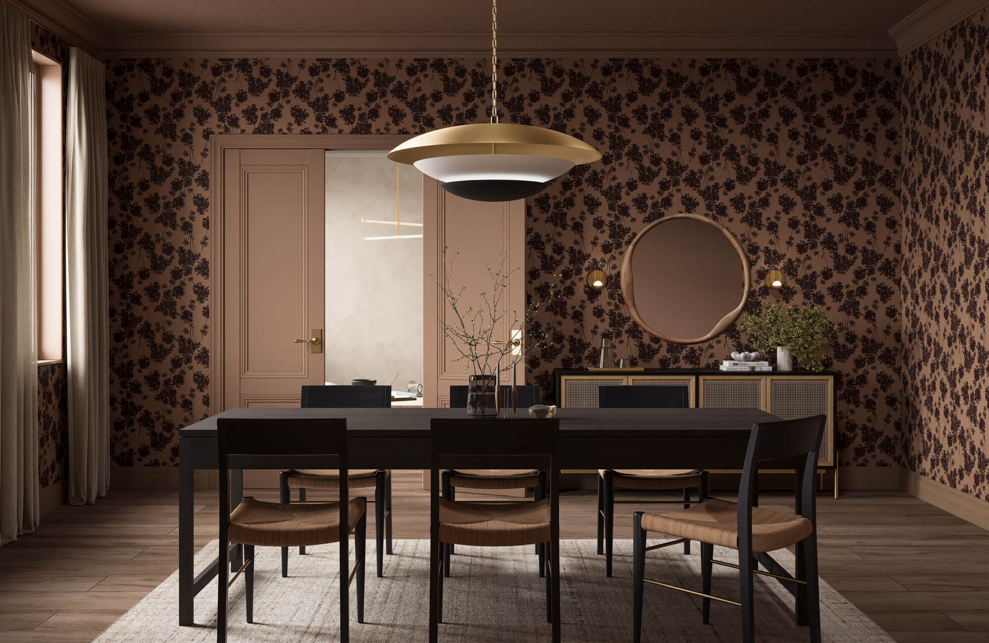 Dark floral wallpaper in a modern dining room with a black table, woven chairs, brass pendant light, and decorative sideboard.