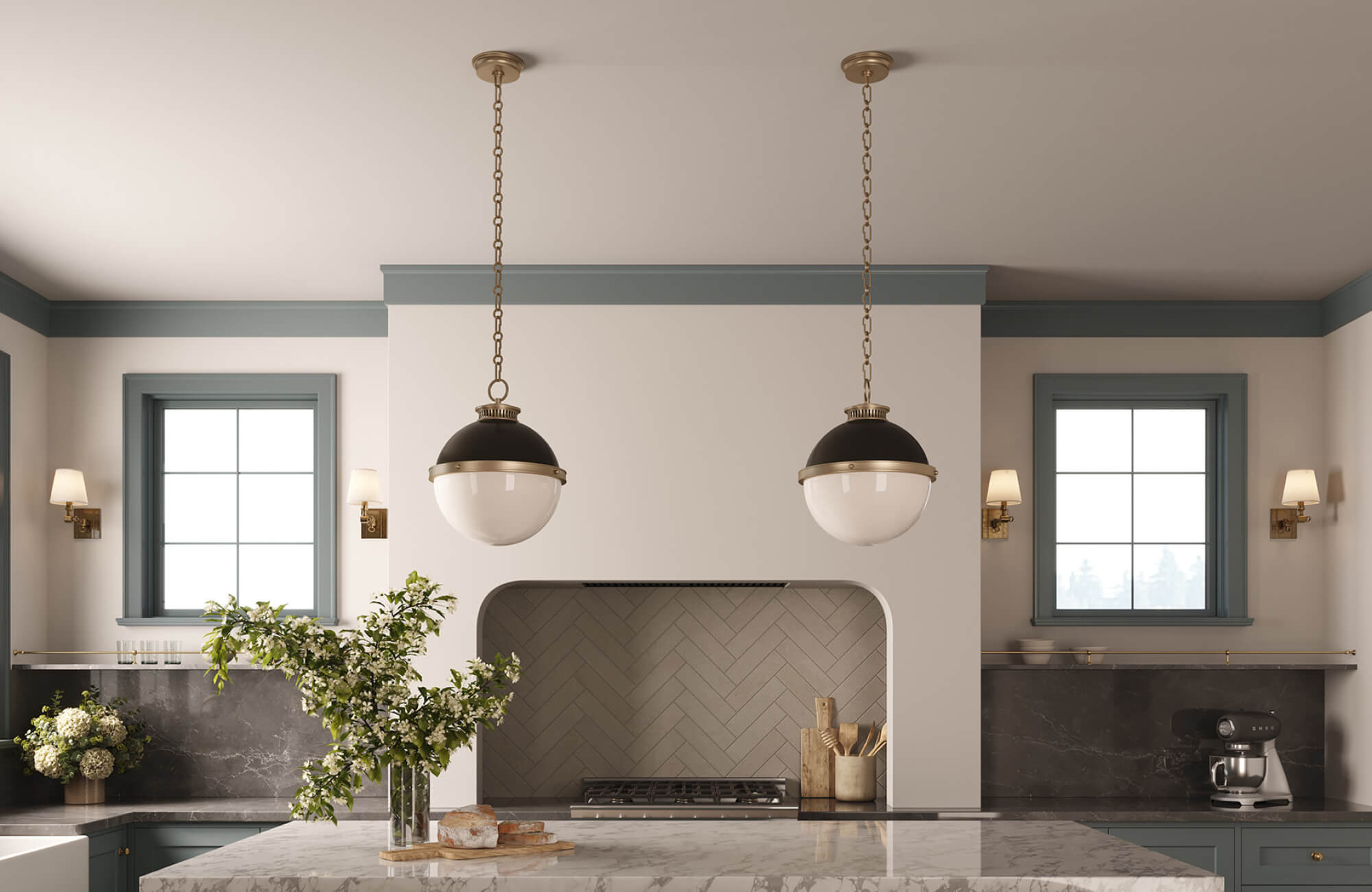 Round globe pendants hanging above a marble kitchen island, centered between two windows for balanced lighting.