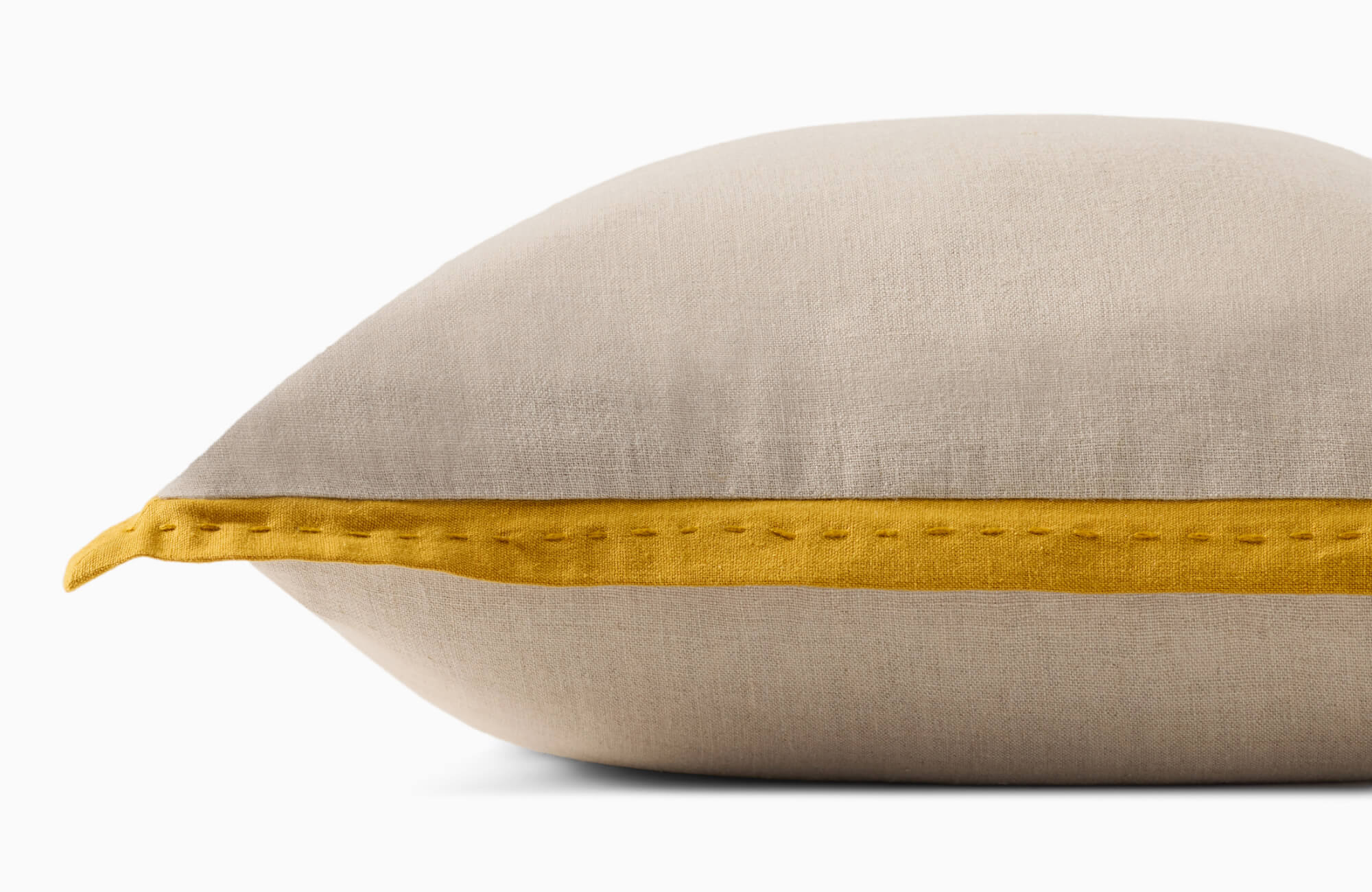 null Beige fabric decorative pillow with mustard yellow stitched trim detail along the edge.