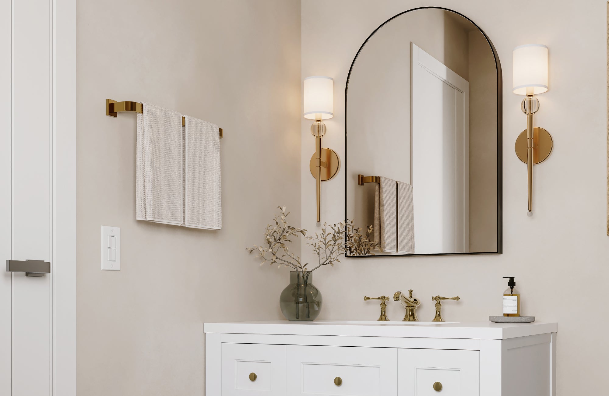 null Slim wall sconces with white shades and brass accents frame a mirror in a neutral-toned bathroom vanity setup.