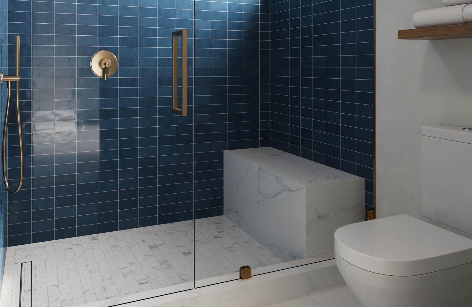Deep blue shower wall tiles with gold hardware and white marble bench, creating a sleek and elegant color pairing.