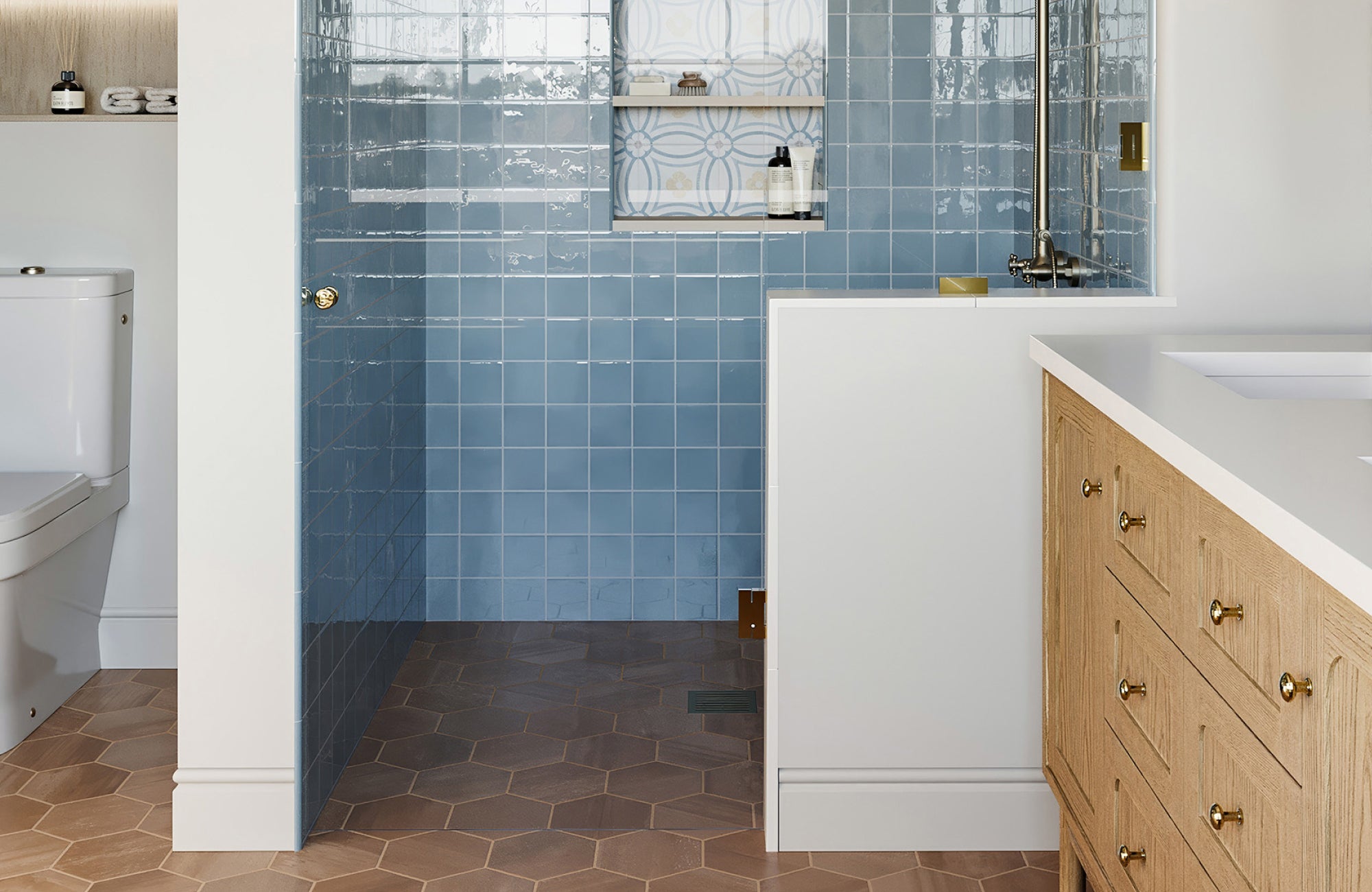 Light blue shower tiles with warm tan hexagon flooring and wood vanity, blending soft blue with warm natural textures.