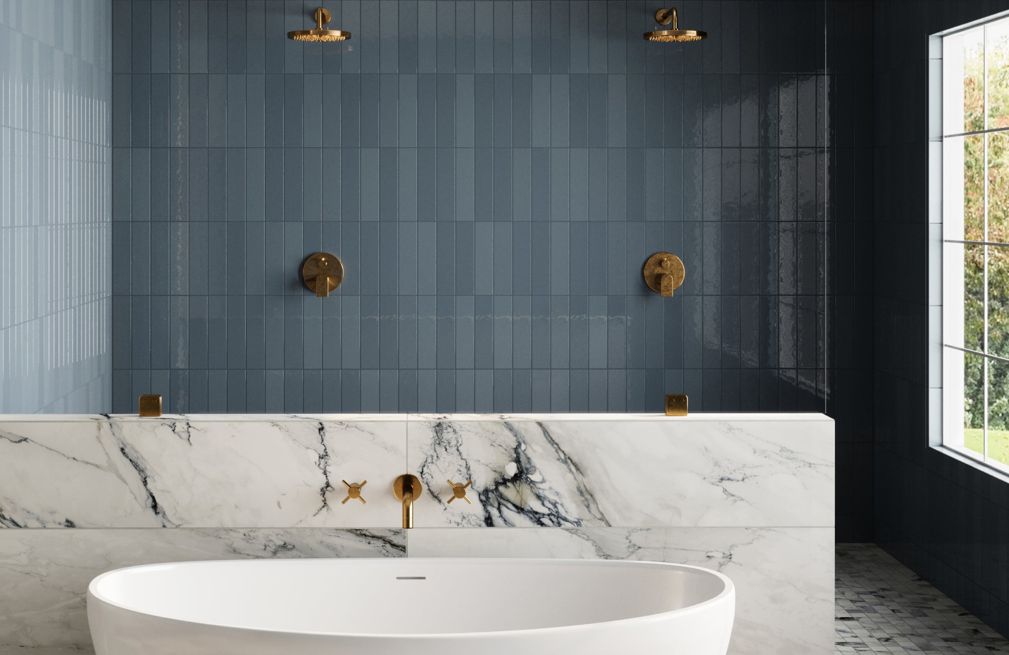 Denim blue wall tiles with gold hardware and marble tub surround, offering a rich combination of cool and warm tones.