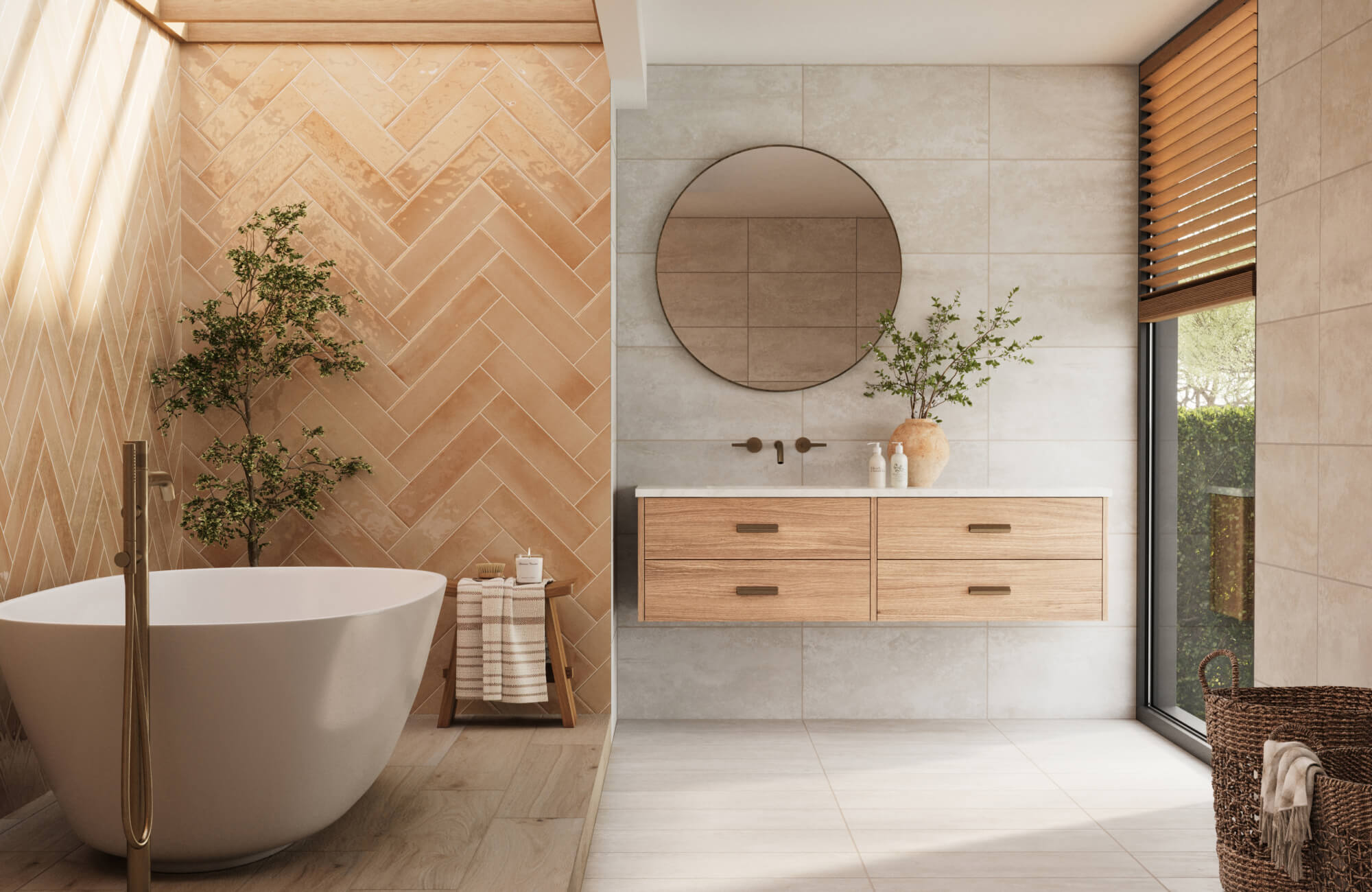 A serene bathroom with a freestanding tub, herringbone terracotta subway tiles, a round mirror above a floating vanity, neutral walls, wood accents, and natural light for a warm, spa-like feel.