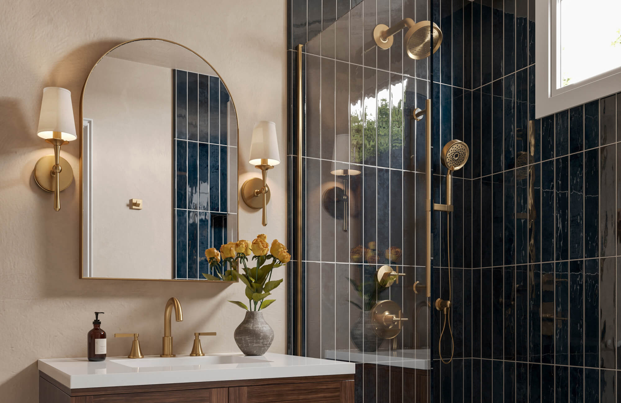 null Bathroom featuring deep navy ceramic tile shower wall with vertical white grout, brass fixtures, warm taupe walls, and double vanity with flowers