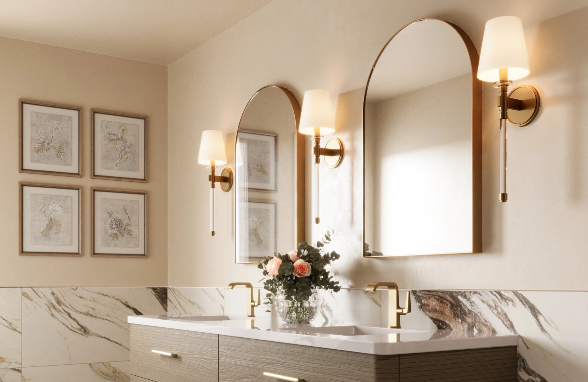 null Classic sconces with tapered fabric shades placed above a double sink vanity with marble accents and arched mirrors.