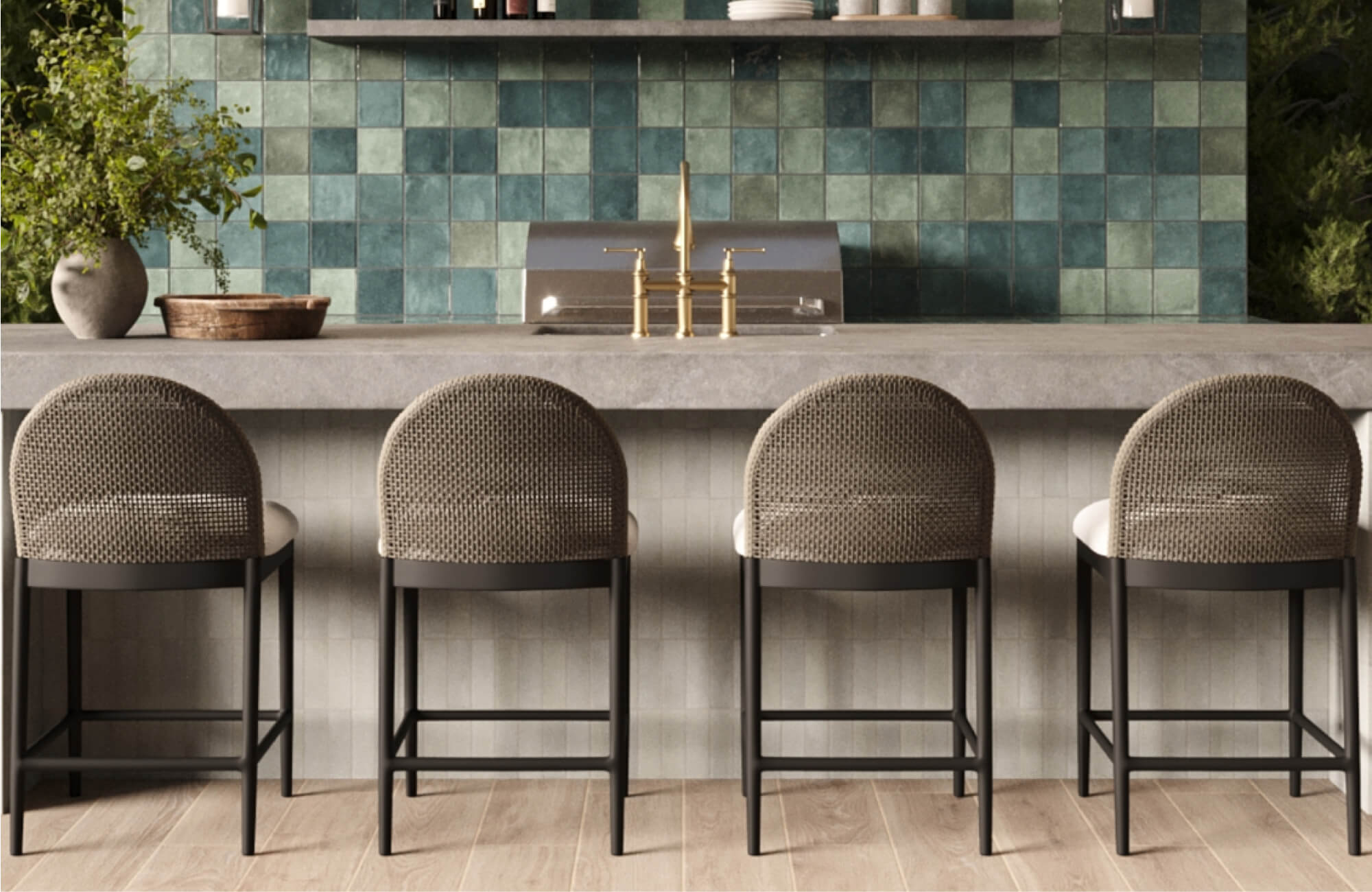 null Outdoor kitchen counter with four woven bar stools, black metal frames, light cushions, and a green square tile backsplash.