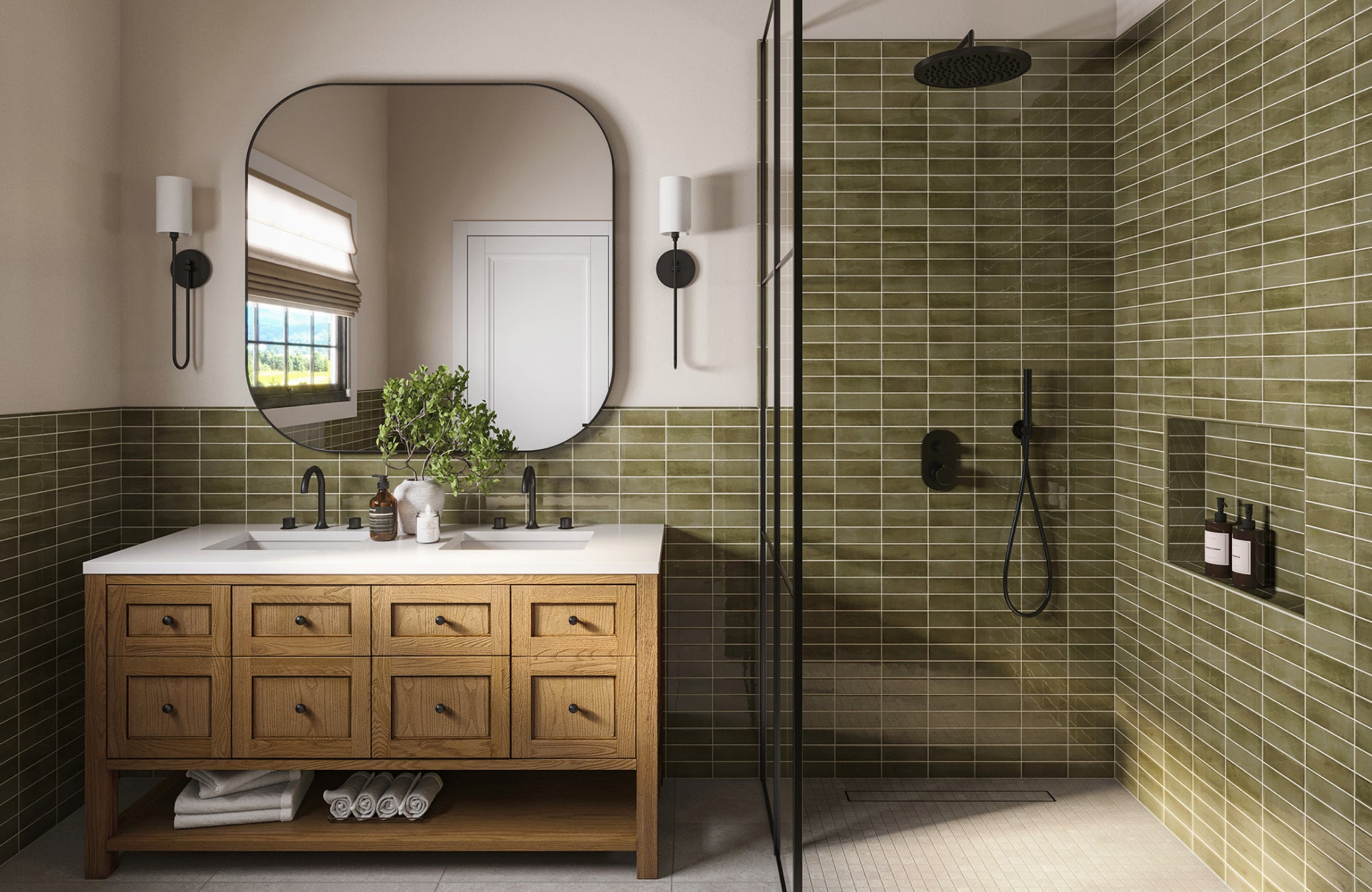 null Rounded-edge square mirror with black trim above a twin-faucet vanity, framed by olive-green tile and glass shower wall