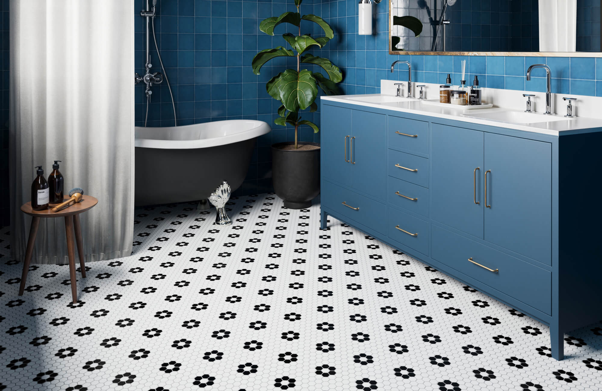White hexagon mosaic tiles with black floral motifs create a playful, vintage-inspired floor in this vibrant blue bathroom.