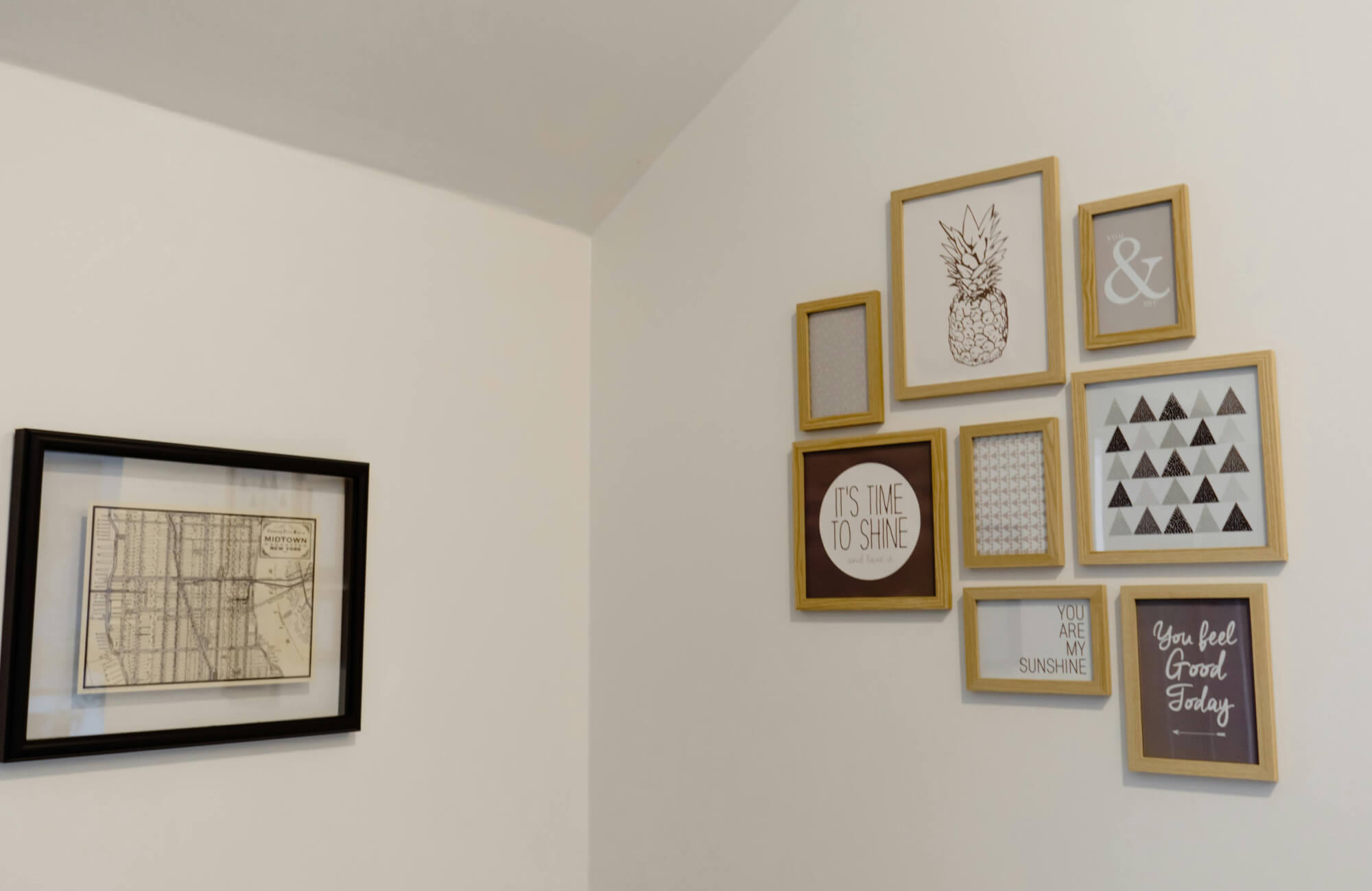 null Light-toned living space with a console and a clustered gallery wall, demonstrating how uneven spacing can disrupt the 2/3 rule and affect overall balance.