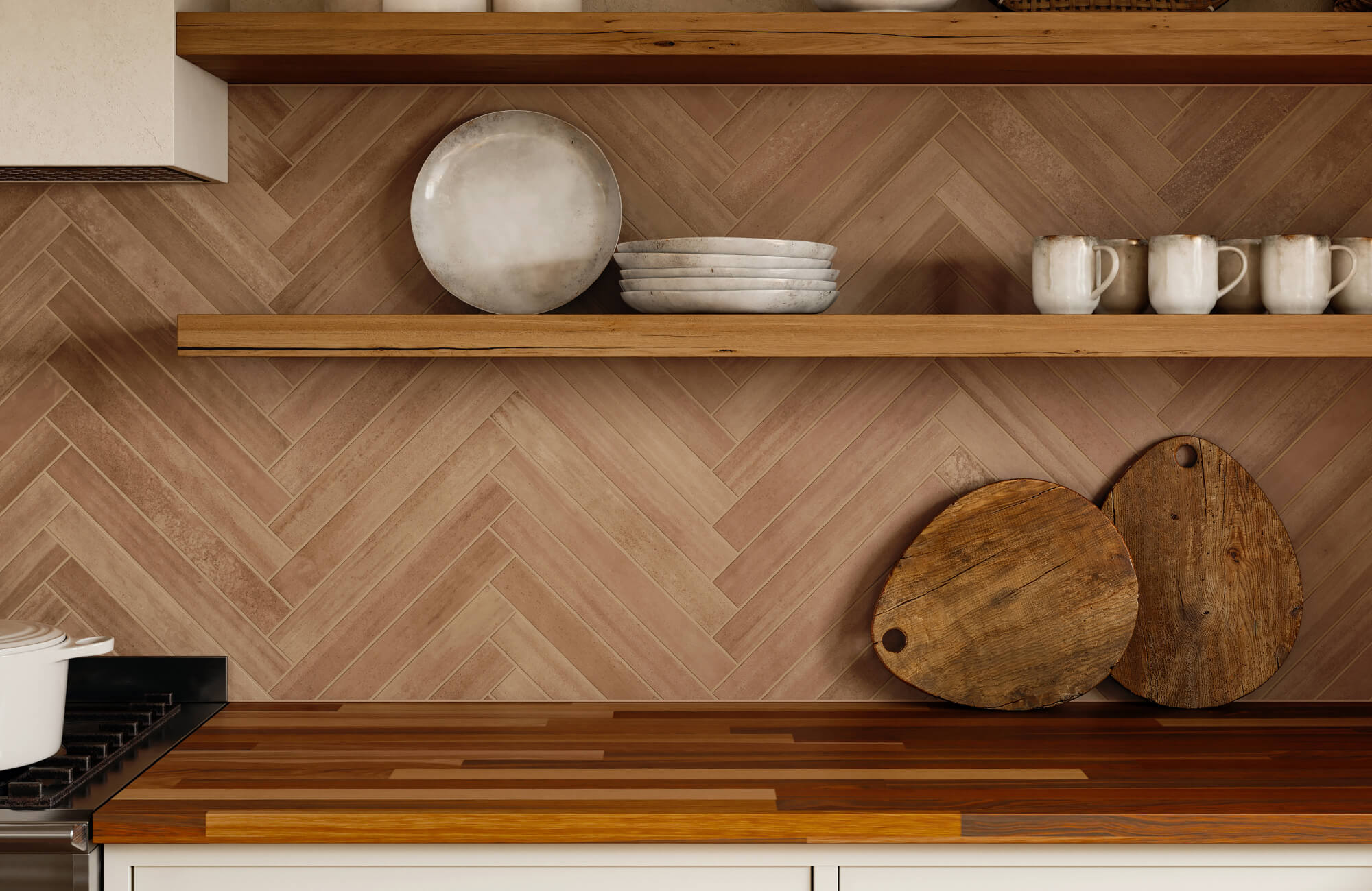 Warm terracotta herringbone tile backsplash with wood open shelves and two-tone butcher block countertop.