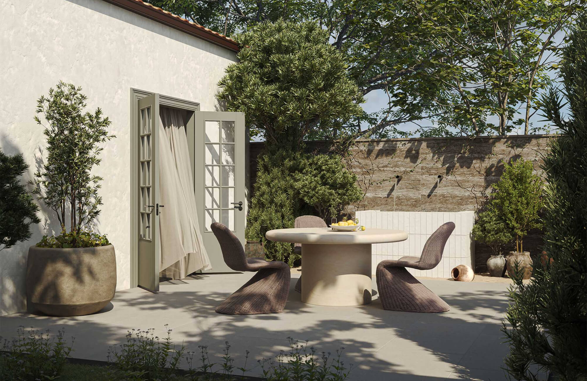 null Contemporary outdoor patio with cream stone table, brown woven chairs, and beige stucco walls with greenery accents.