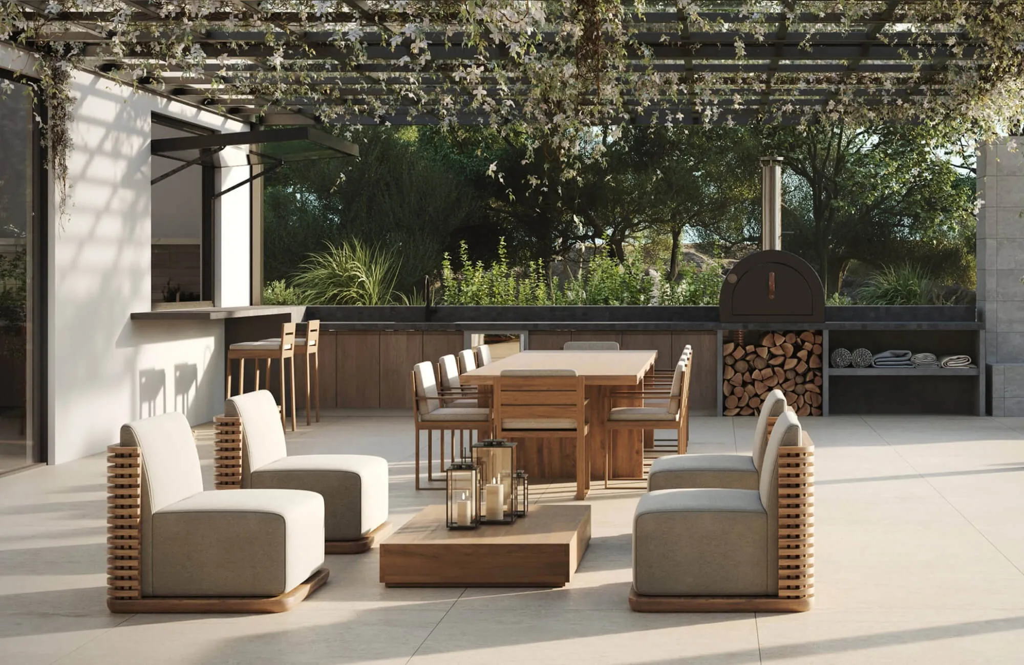 Outdoor patio with a wooden dining table and cushioned chairs beneath a vine-covered pergola, with lounge seating, a built-in bar, and a wood-fired oven in the background.