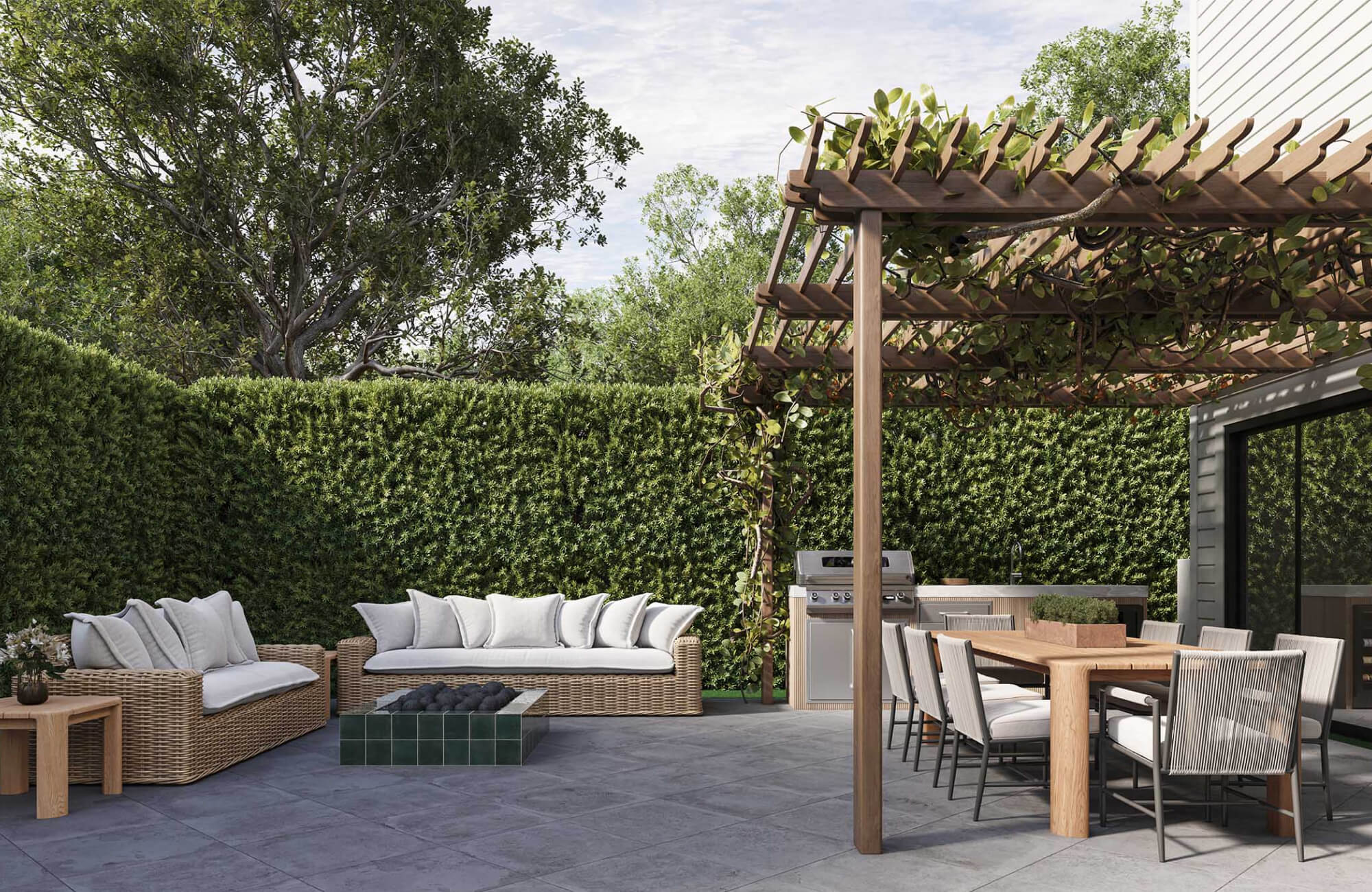null Spacious backyard dining area with a wood table, cushioned chairs, outdoor kitchen, and lounge seating arranged beneath a vine-covered pergola.