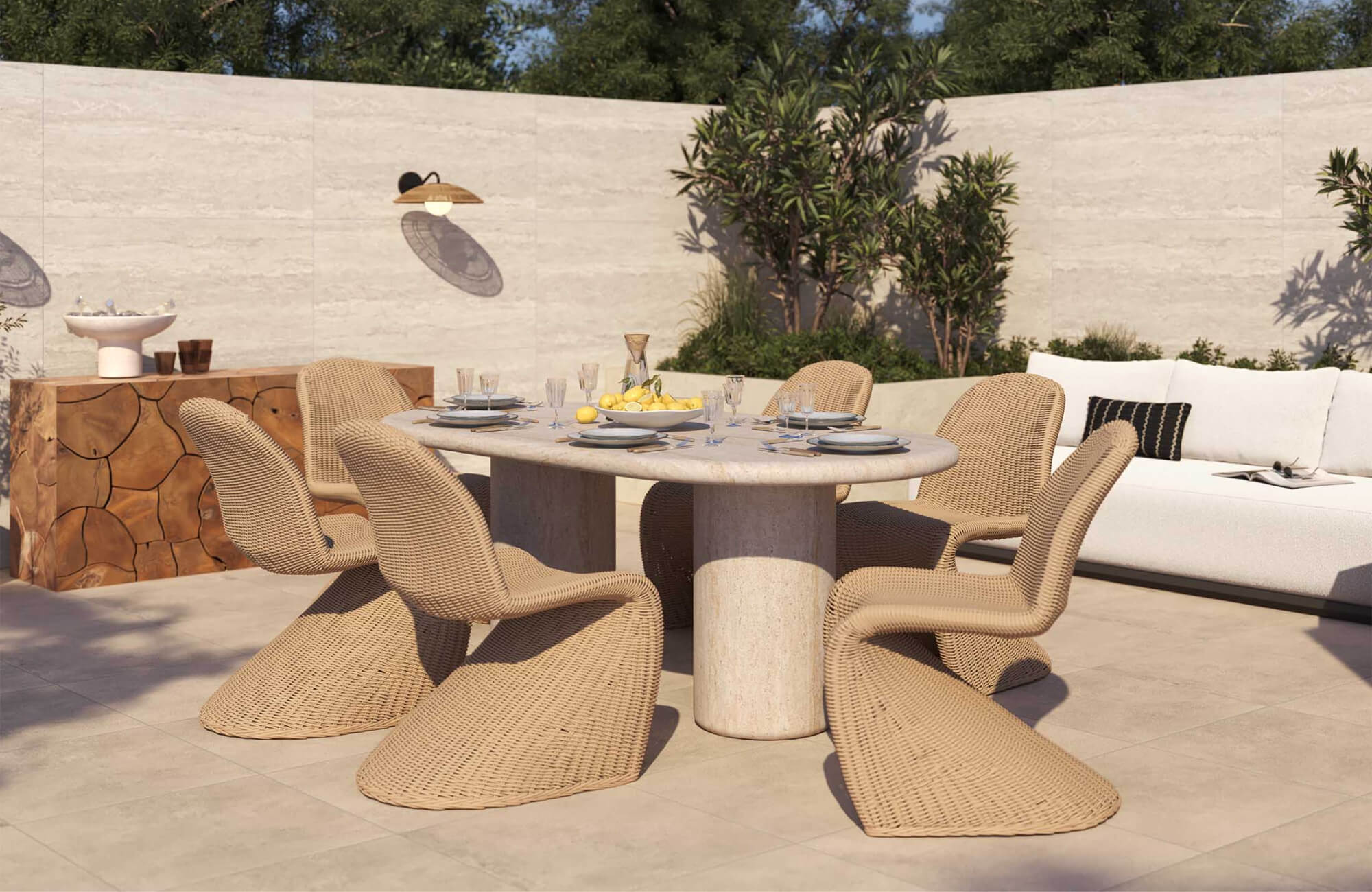null Modern outdoor dining patio with a rounded stone table, woven chairs, a wood sideboard, built-in lounge seating, and a high privacy wall.