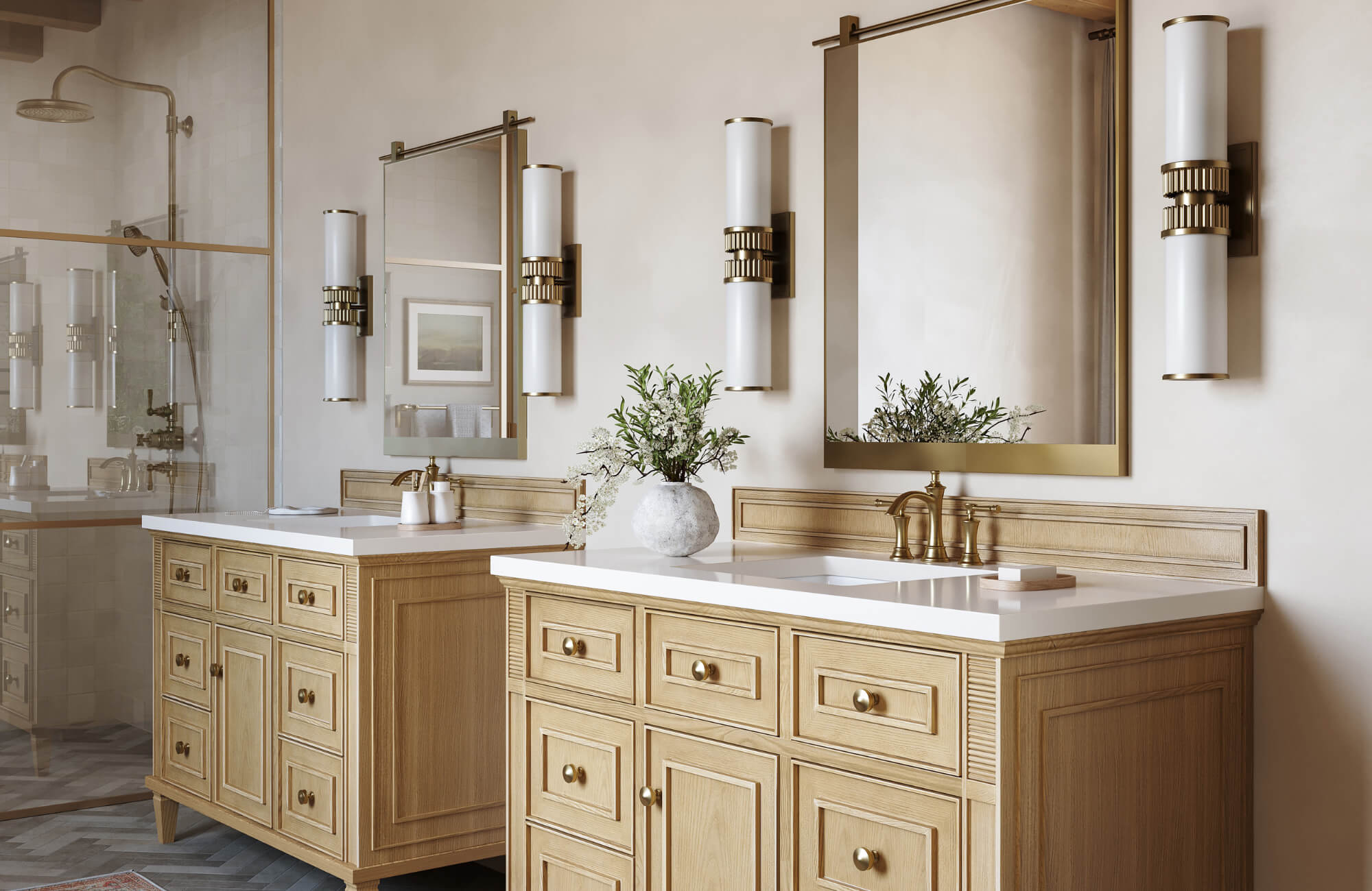 null Elegant bathroom with double vanities, brass fixtures, and vertical sconces flanking mirrors above light wood cabinetry and white countertops.