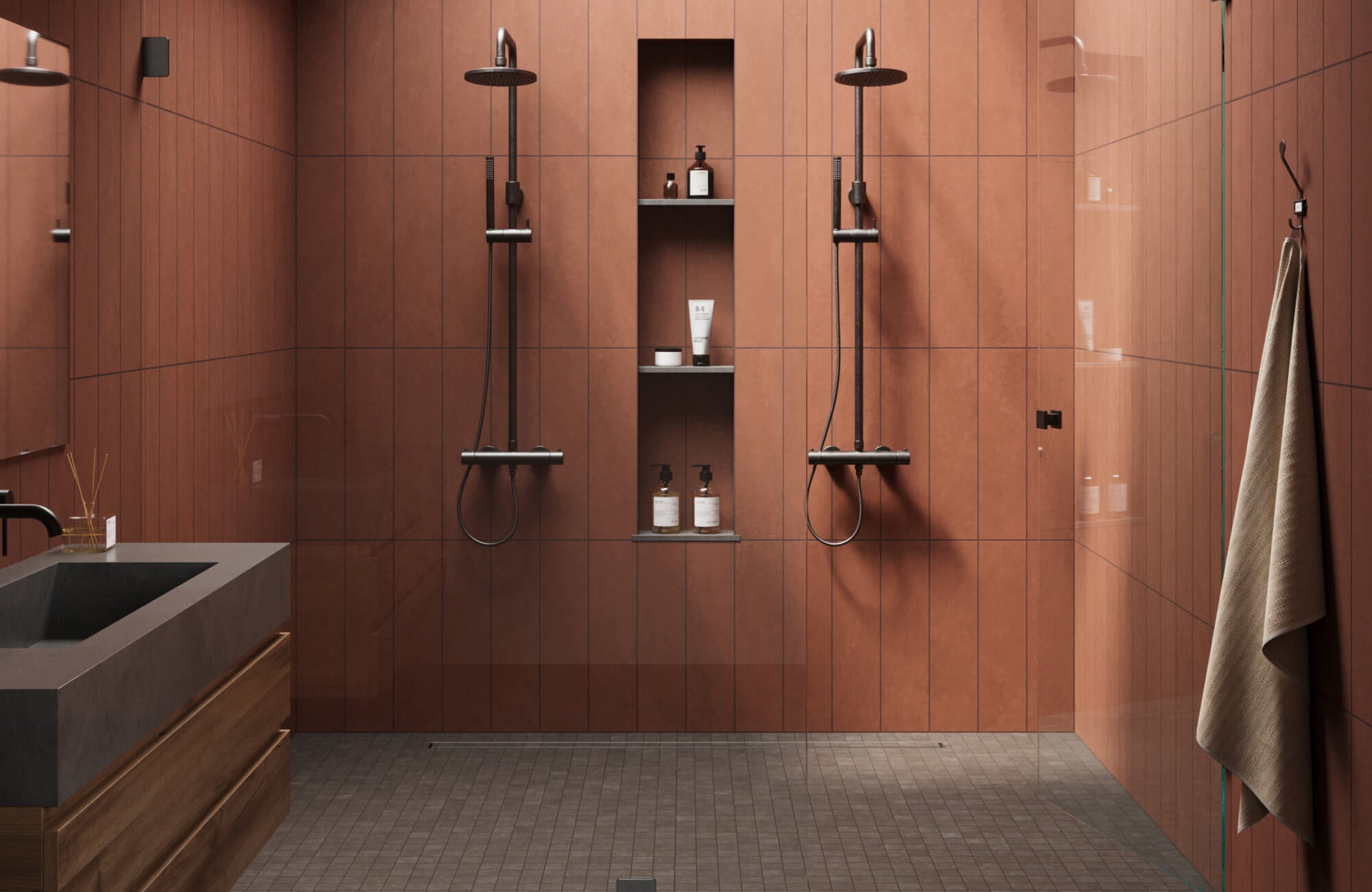 Warm red shower wall tiles paired with small gray floor tiles and black fixtures, creating a clean and easy-to-maintain shower setup.