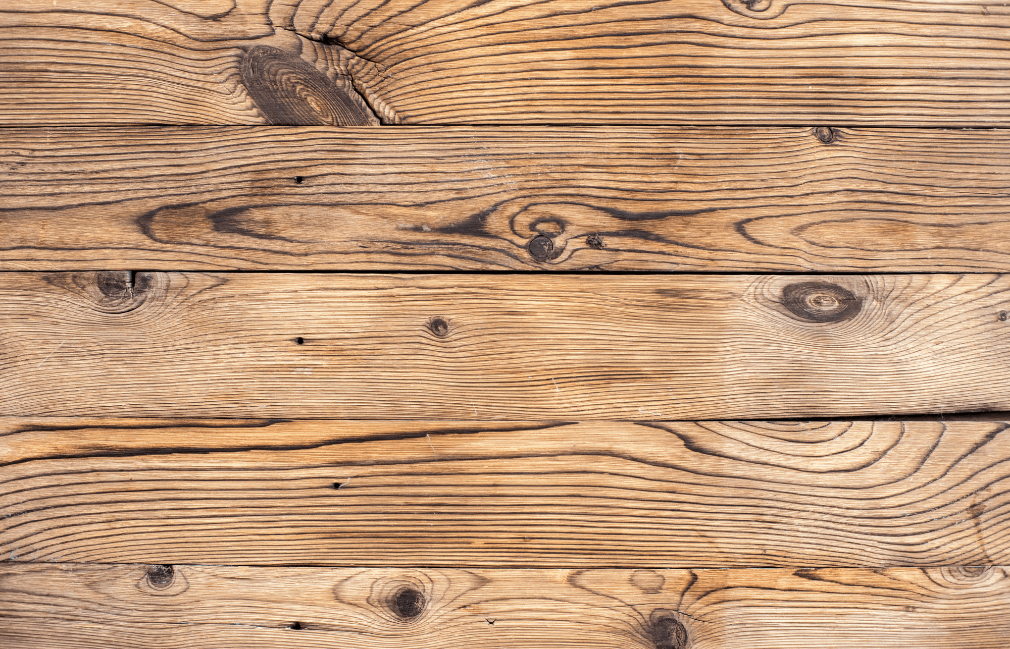 null Close-up of rustic cedar wooden planks showcasing natural grain patterns, knots, and warm tones for a timeless, textured look.