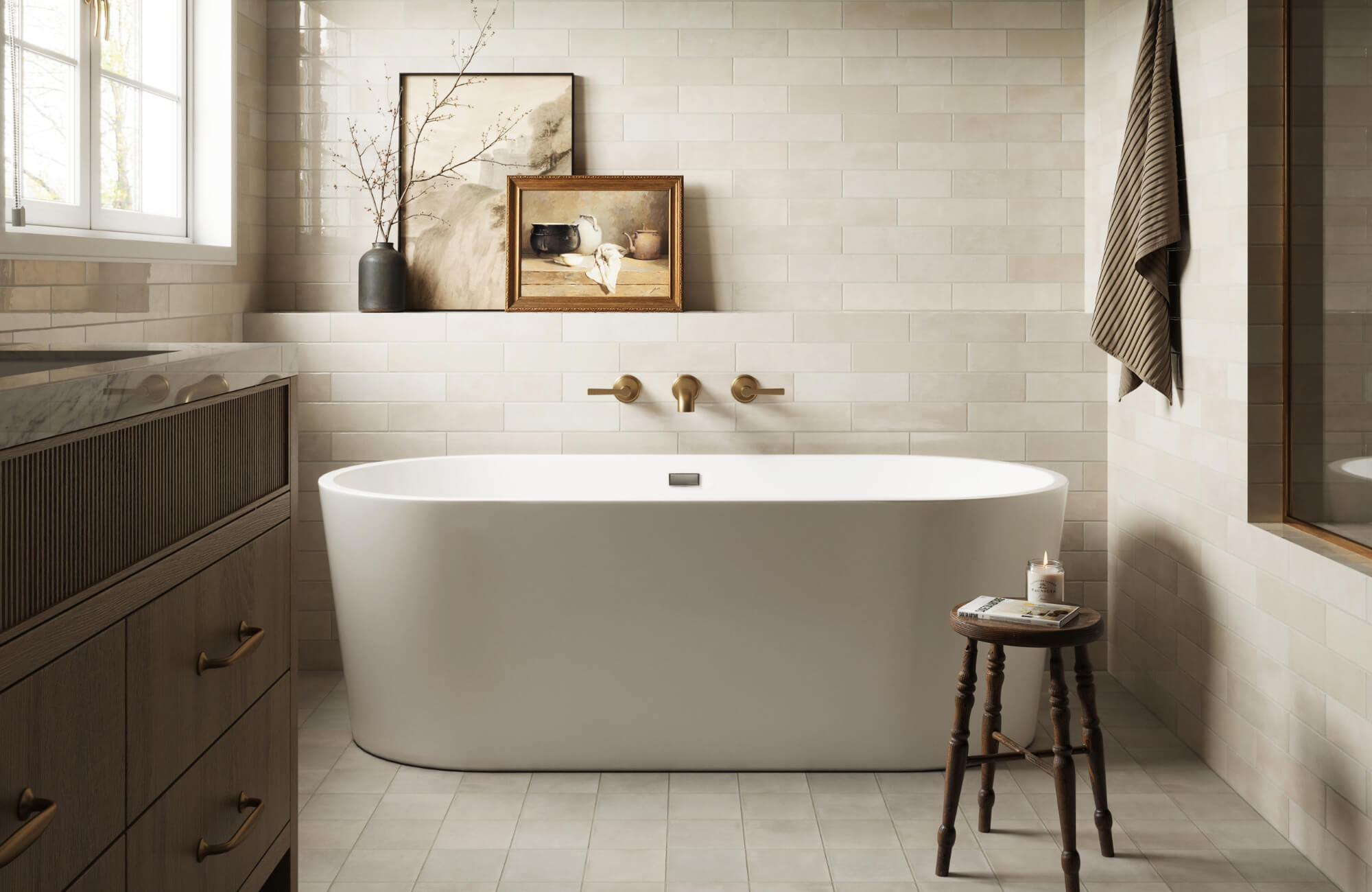 null Elegant bathroom with a white freestanding tub, beige subway tile walls, brass fixtures, and warm wood cabinetry and accents.