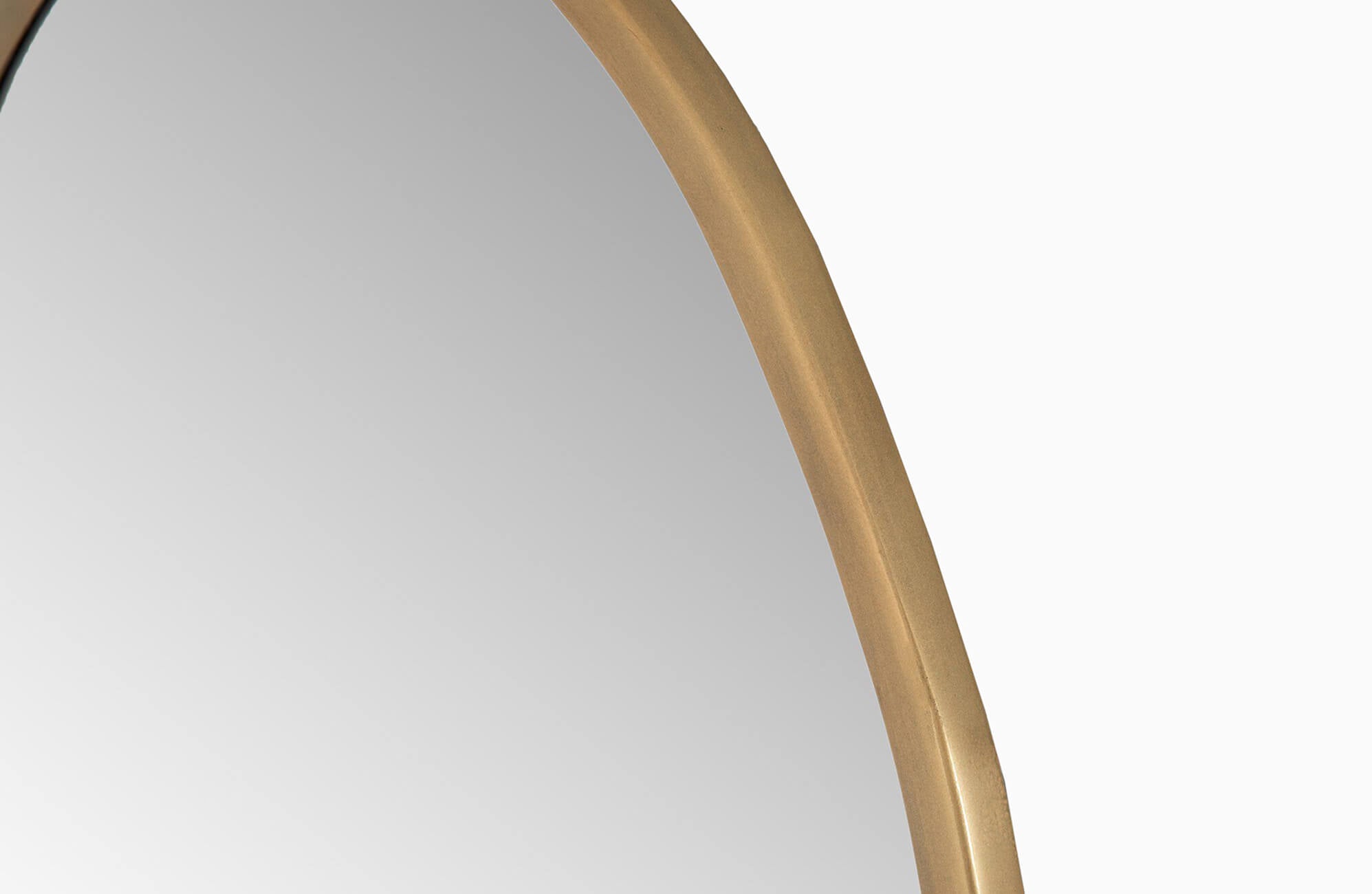 Close-up of a bathroom mirror featuring a smooth gold frame with a gently curved edge, adding a touch of elegance and warmth to the design.