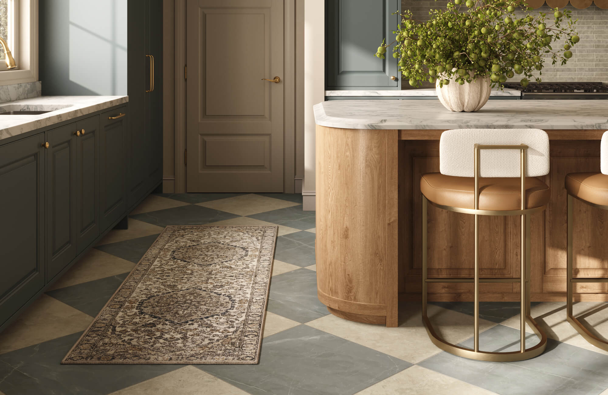Refined kitchen with checker-pattern tile flooring, a vintage runner rug, marble-topped island, wood cabinetry, and brass-accented stools.