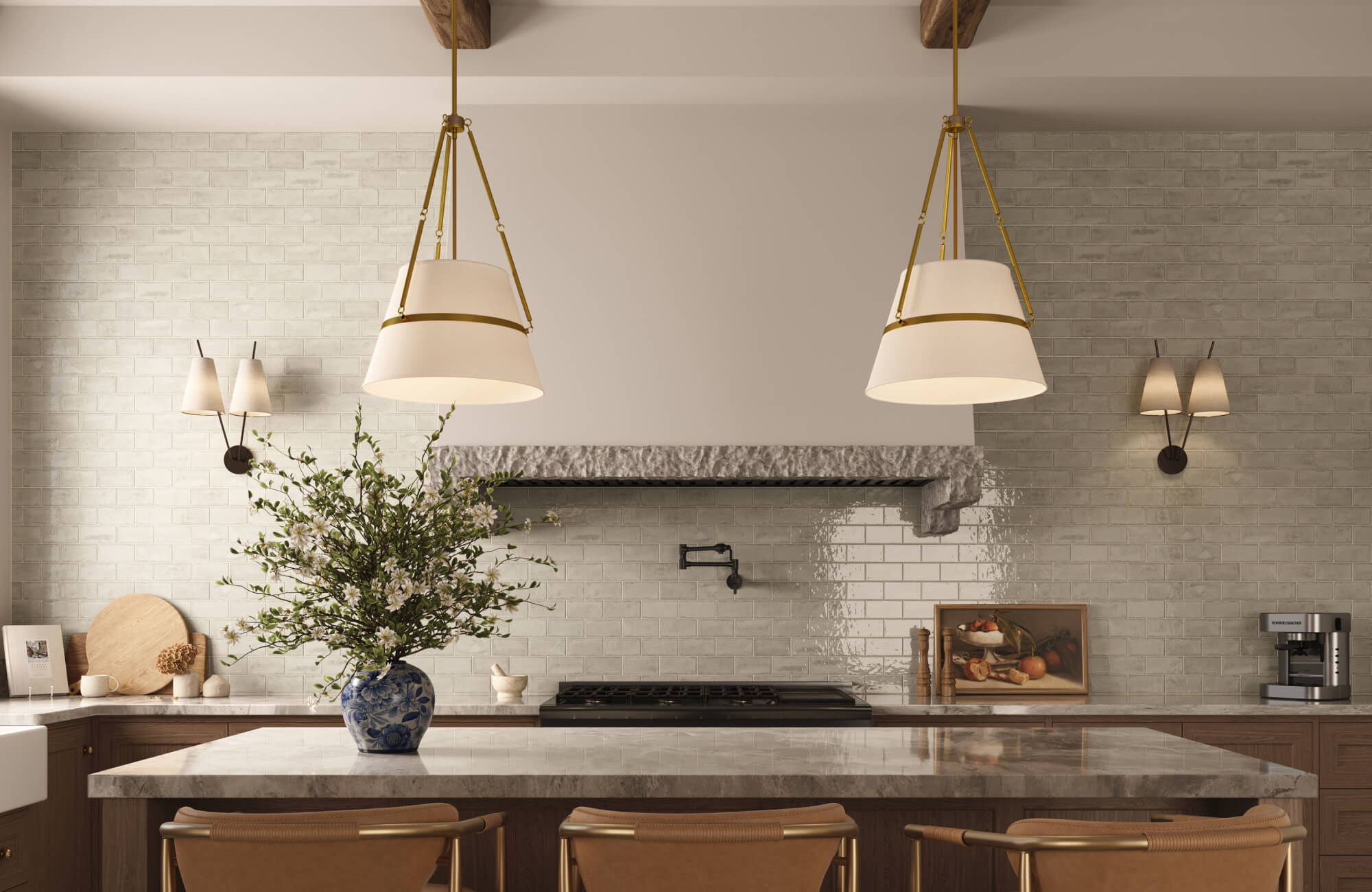 Glossy pale brick tiles add subtle texture behind sculptural cream pendant lights in this refined, rustic-style kitchen.