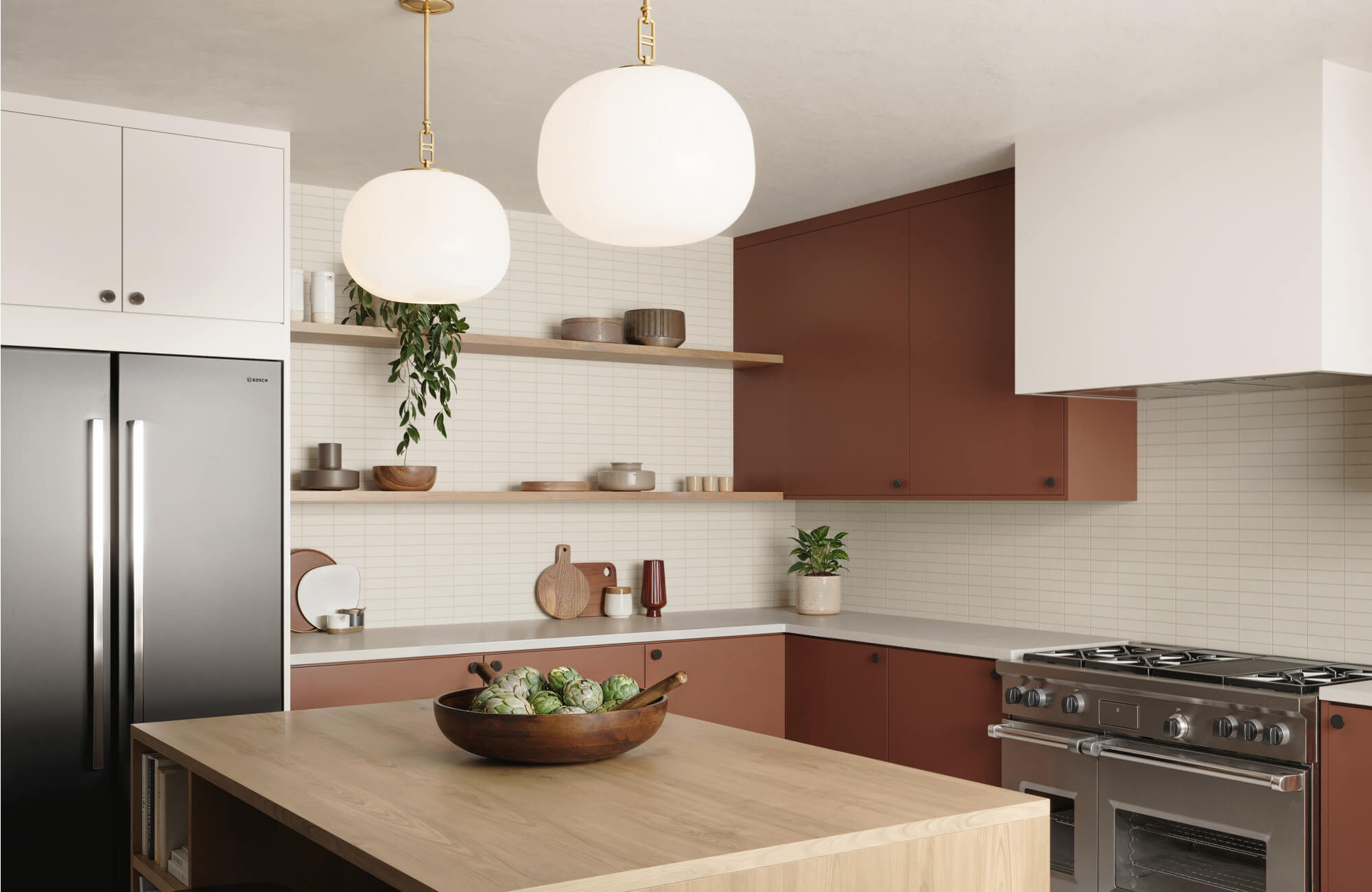 Slim off-white stacked tiles set a clean backdrop for globe pendant lights and terracotta cabinetry in this modern kitchen.