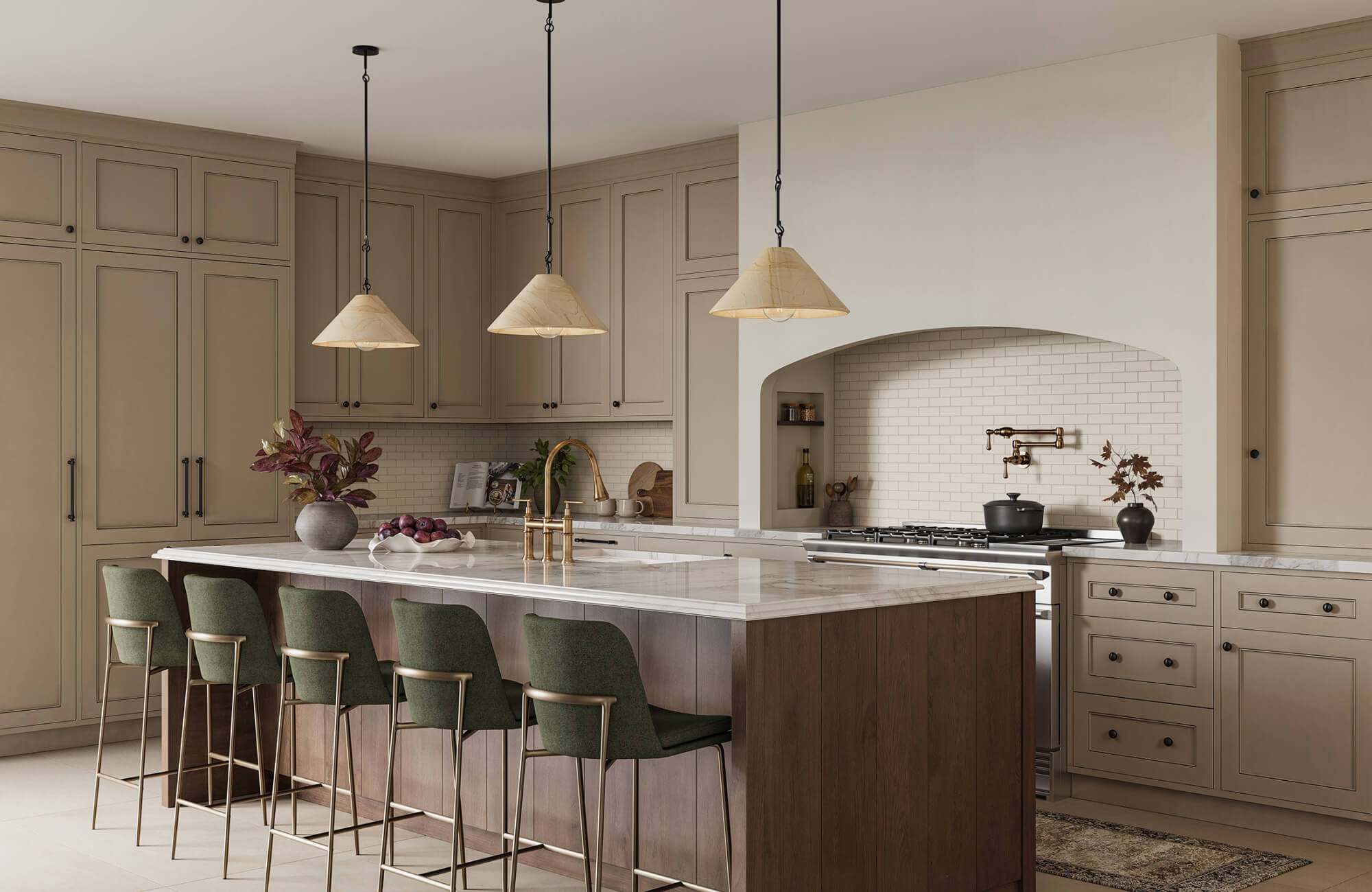 Creamy subway tiles line the arched backsplash, paired with warm cone pendant lights and sage green barstools in this elegant kitchen.