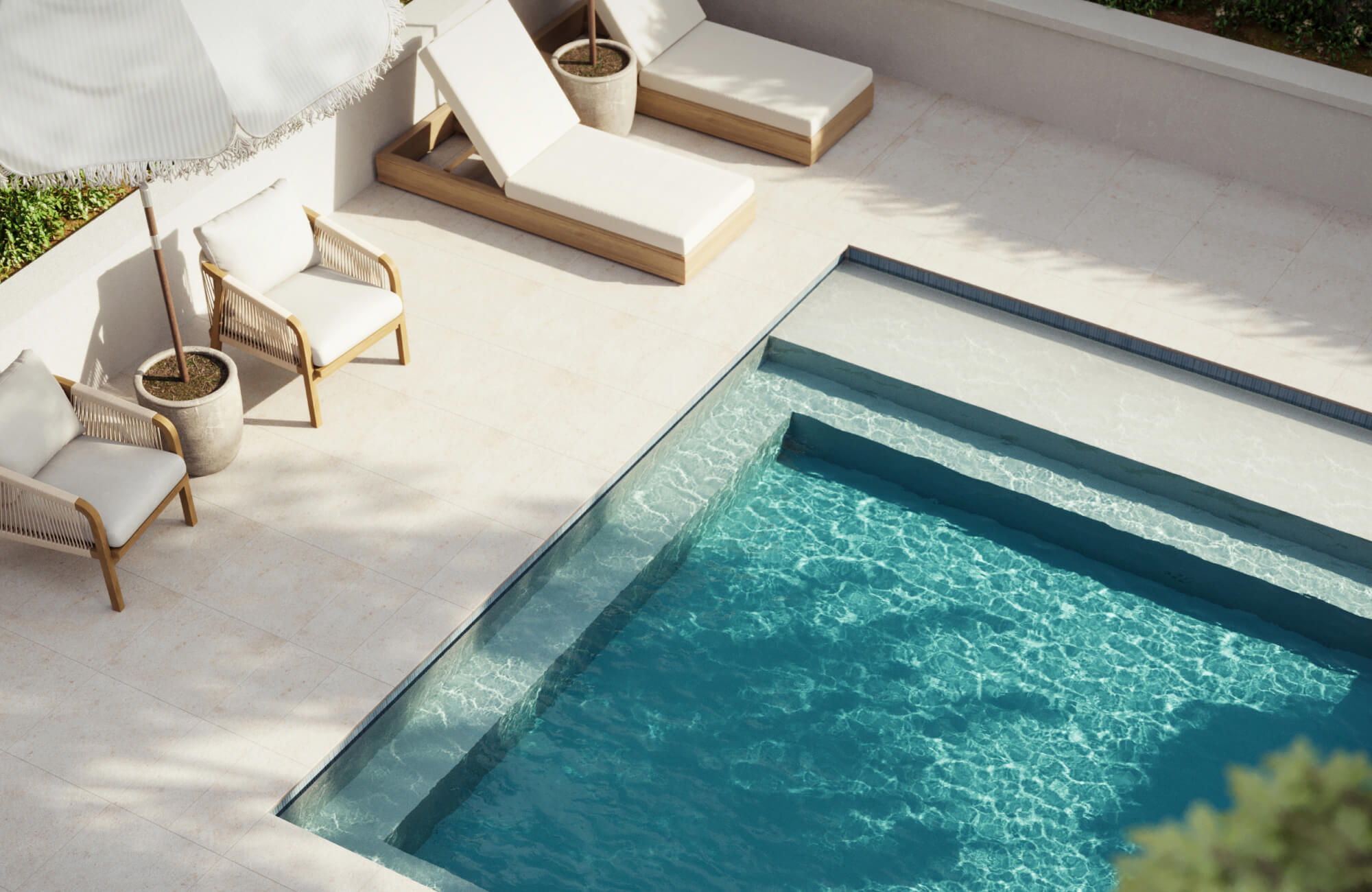 null Sleek poolside patio with soft beige porcelain stone tiles, creating a serene backdrop for lounge chairs and crisp blue water.