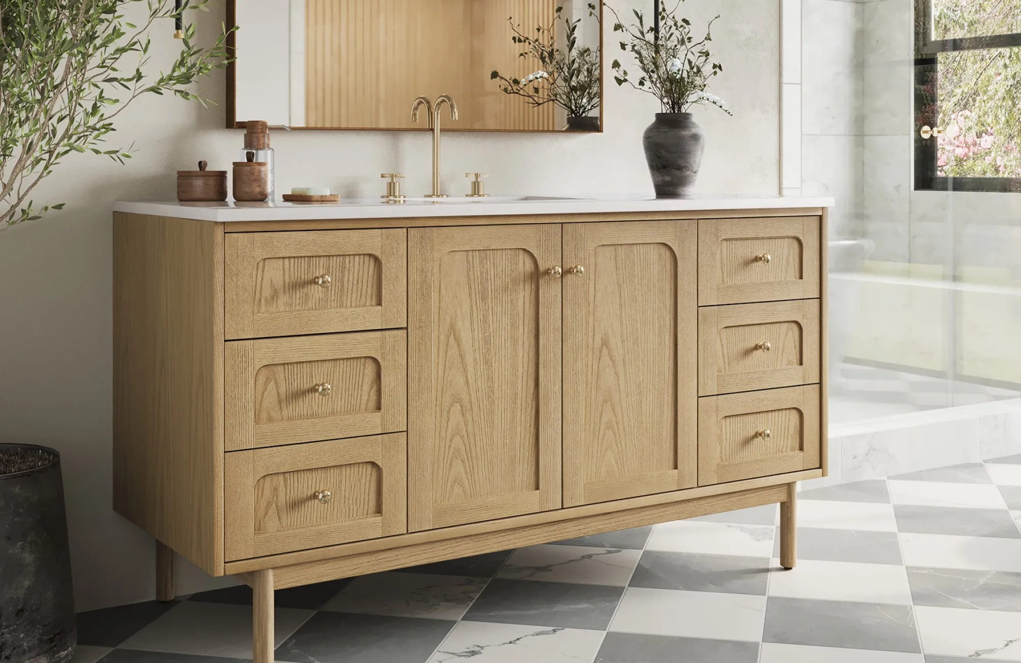 60-inch natural oak single vanity with gold hardware and white countertop, styled in a marble-accented master bathroom.