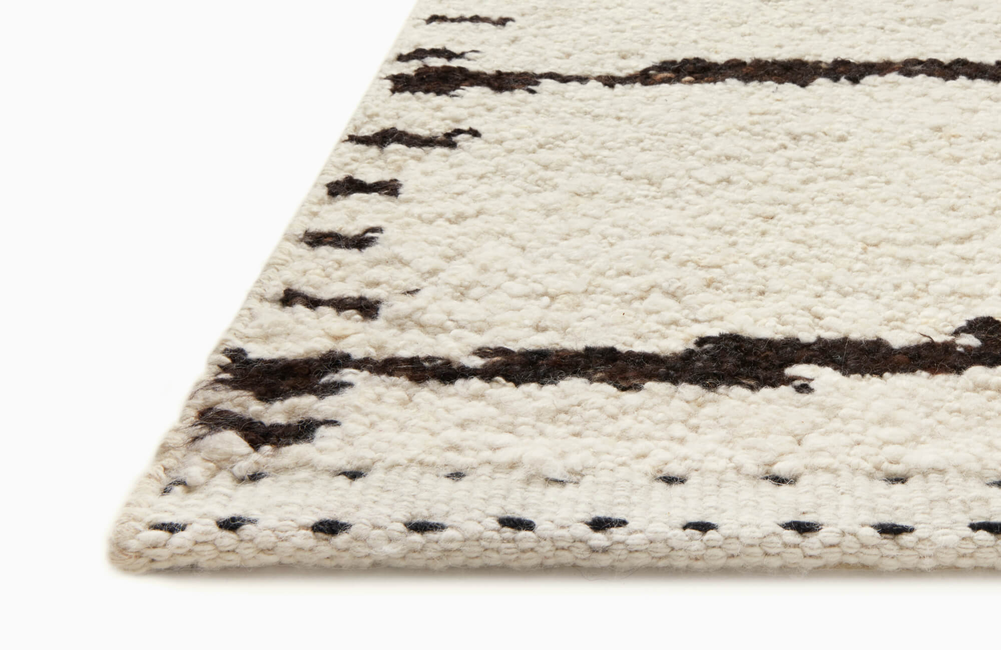 null Neutral textured wool rug with subtle black linear pattern and soft high-pile surface detail.